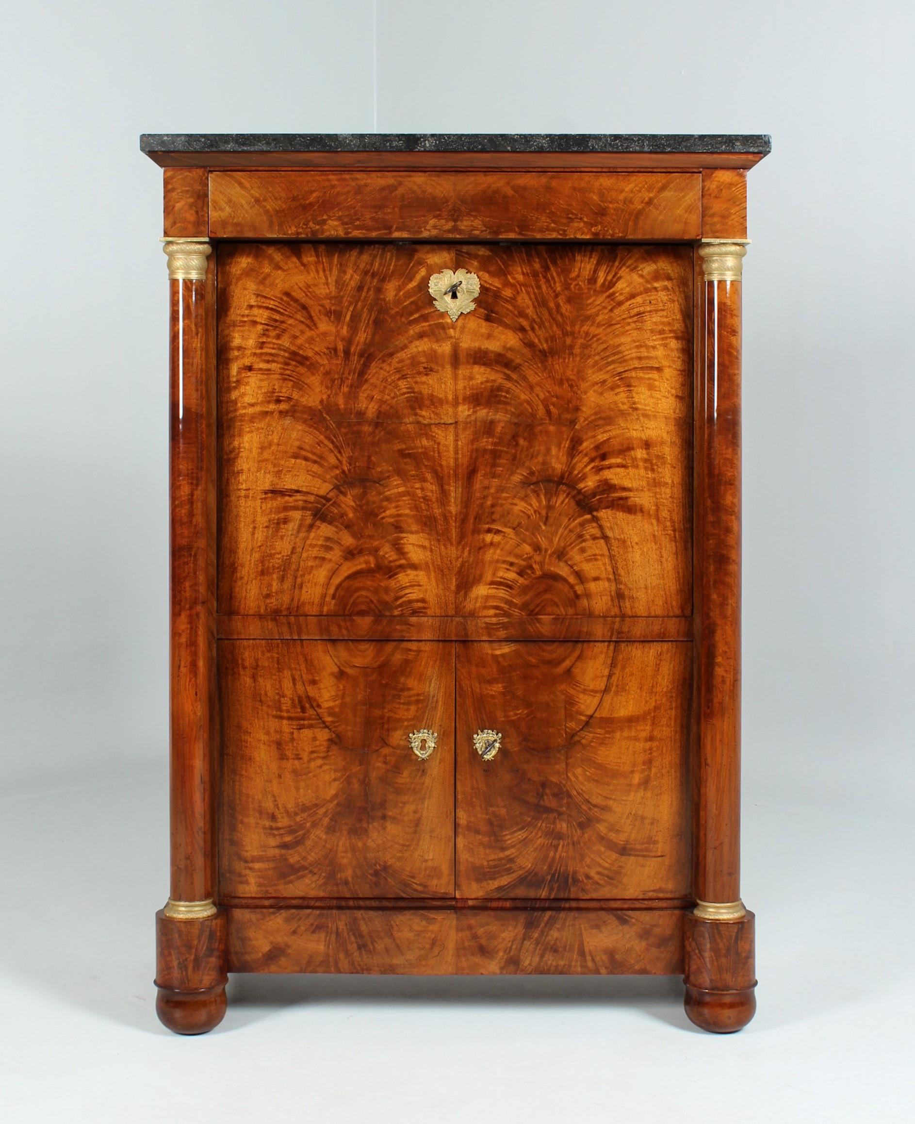 Antique Empire Secretary

France
Walnut
Empire around 1820

Dimensions: H x W x D: 143 x 98 x 49 cm

Description:
Very fine French writing desk with delicate dimensions. The above dimensions are measured at the marble top, the width of the body is