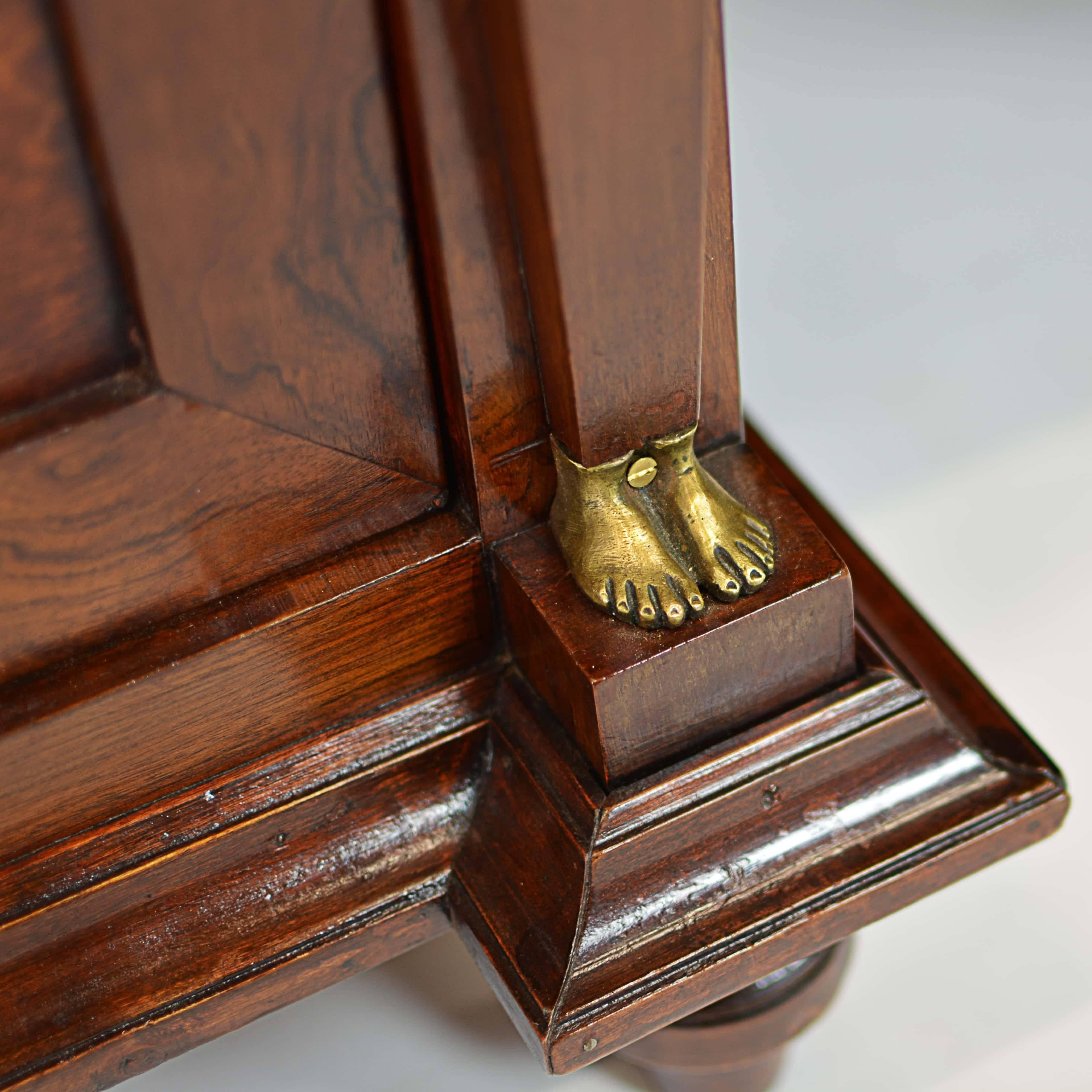 Imposing elegance for the estate office. Rare to find such a quality heavy wooden desk from France from the Napoleonic era, circa 1815. The dark, rich finish and classical-themed gilt ornaments are perfect examples of post-Revolution design; the