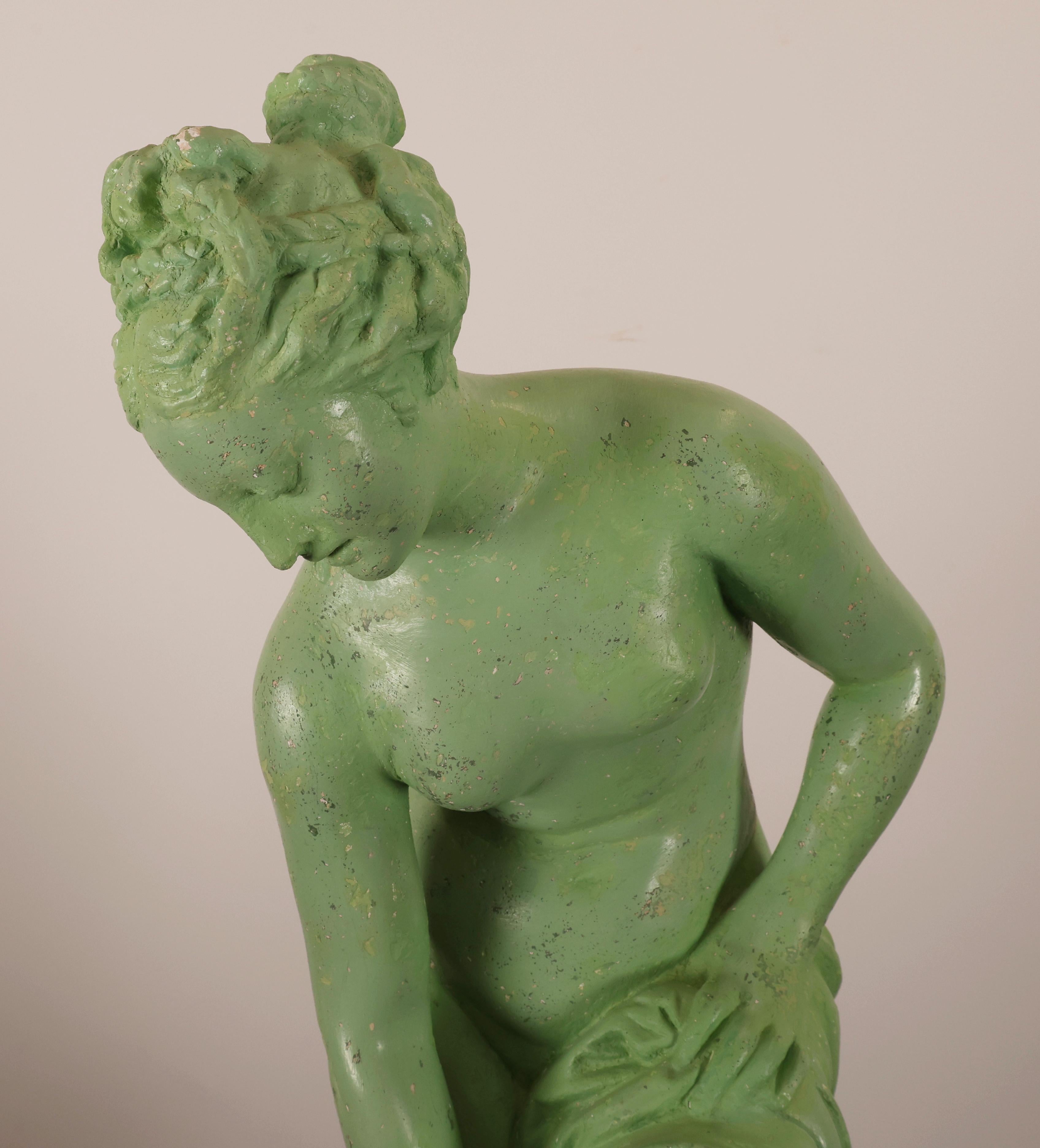A decorative sculpture depicting Venus emerging from the bath. The sculpture was made of plaster during the Empire period, likely in Sweden. The color is the original, restored finish.