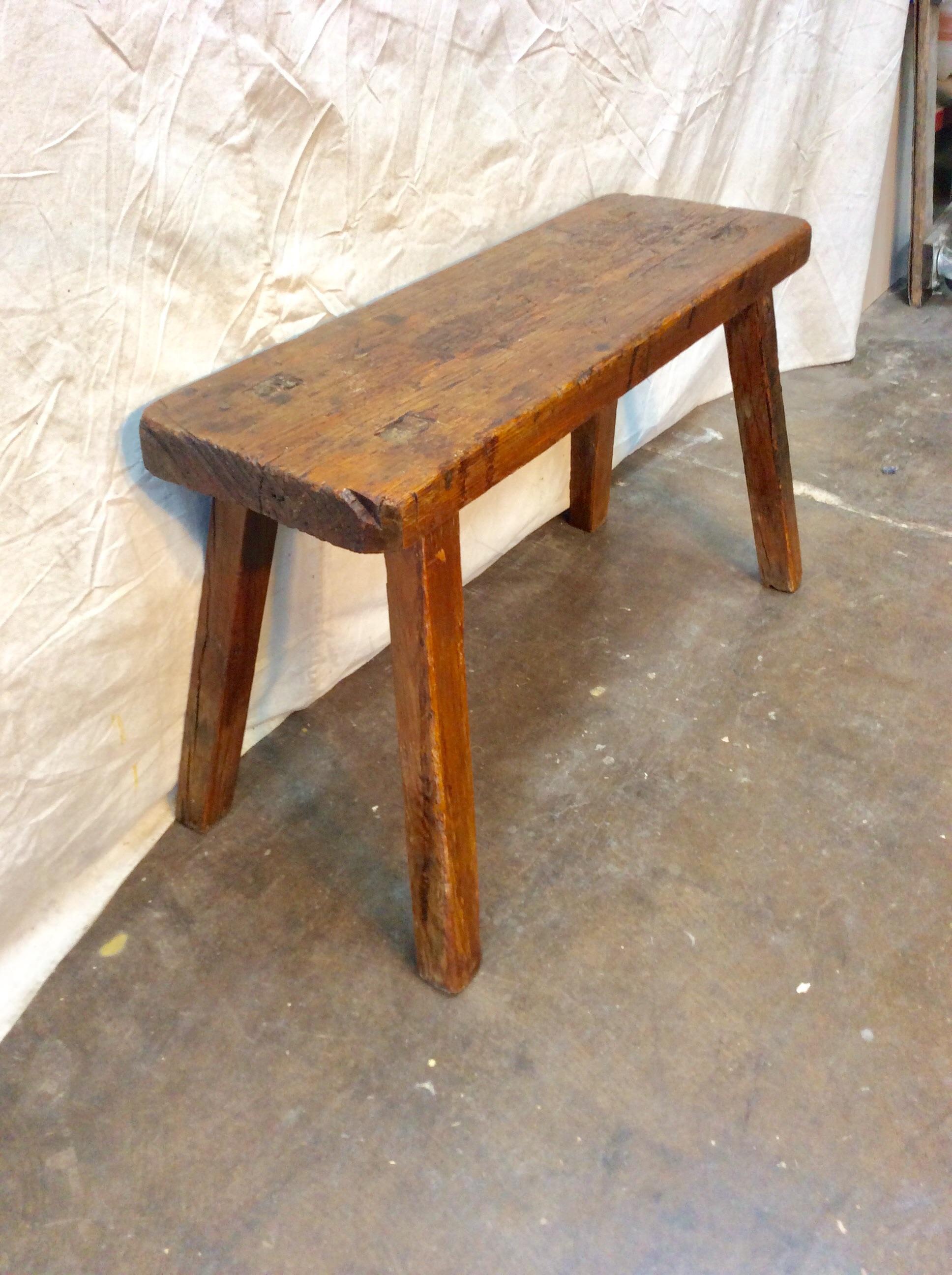 This 19th century carpenters bench from England is large enough to serve as a narrow coffee table. The bench features mortise and tenon construction on a 2