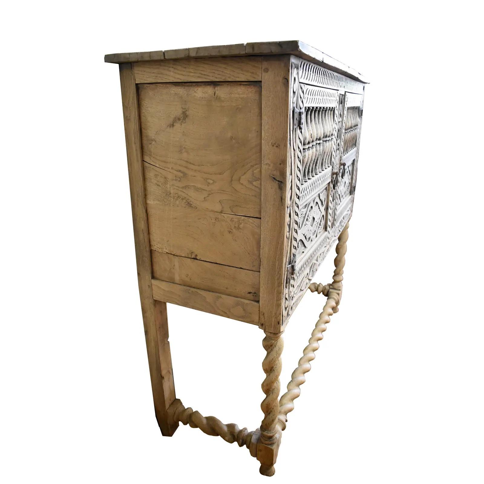 Beautifully carved and proportioned English Panettiere/Livery cabinet from the early 1800s. The piece is made of solid English Oak using pegged construction. It was bleached to delicate creamy white color, making it a piece that can fit well with