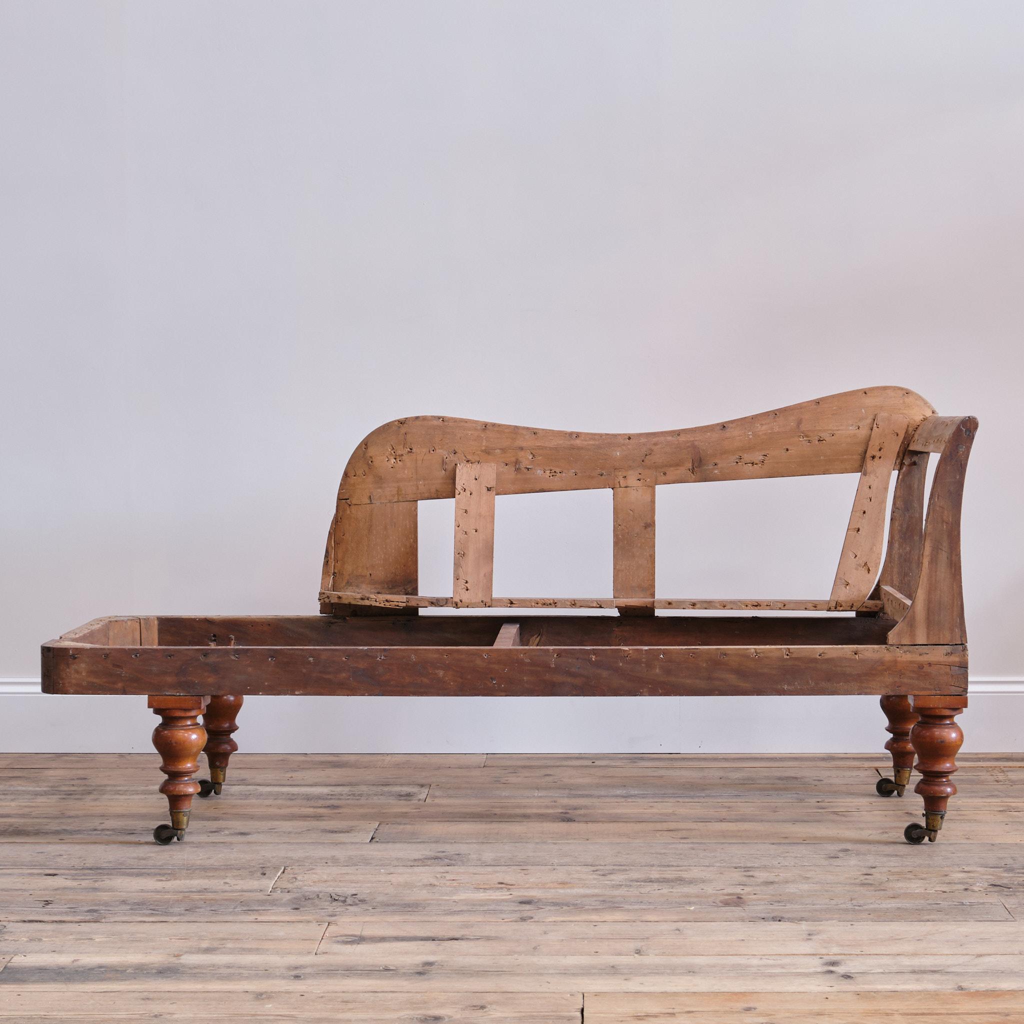 A wonderful early 19th century chaise frame. Raised on walnut turned legs with the original brass casters. The frame constructed in birch and pine.

In good strong order and for upholstery  

As with all my upholstered seating I do offer upholstery