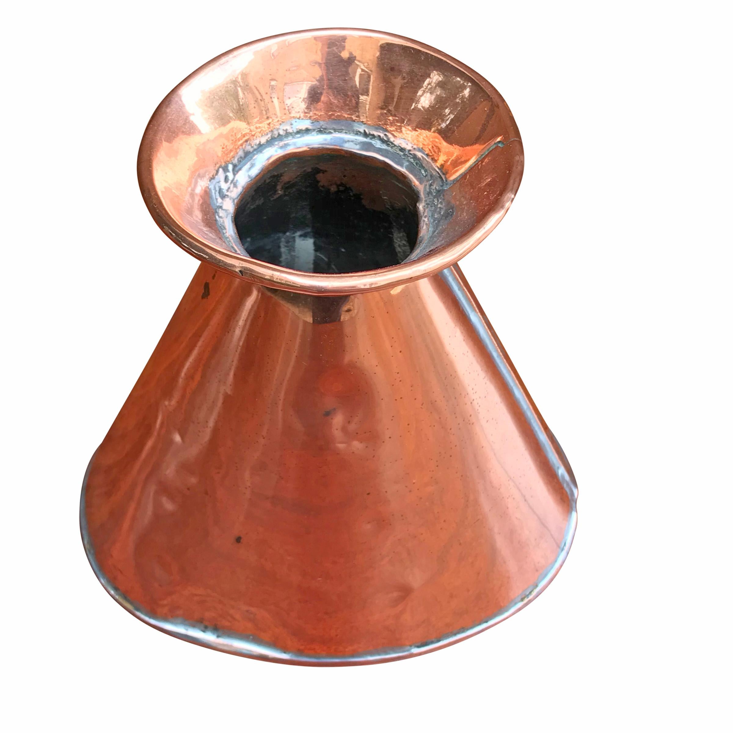 An early 19th century English, Victorian period, copper pitcher of tapered ovoid form with a flared lip. This is water tight, and would make the best vases with fresh flowers.