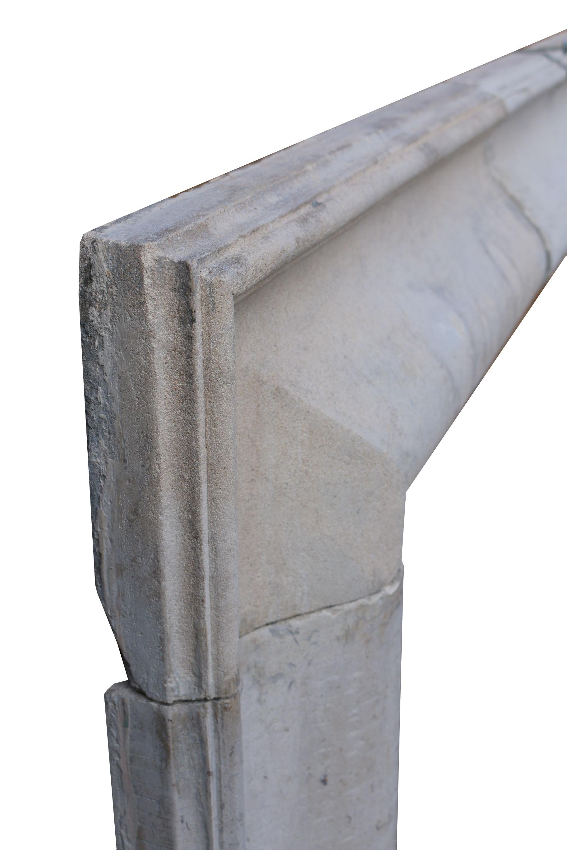 Carved Early 19th Century English Cotswold Limestone Bolection Fire Surround