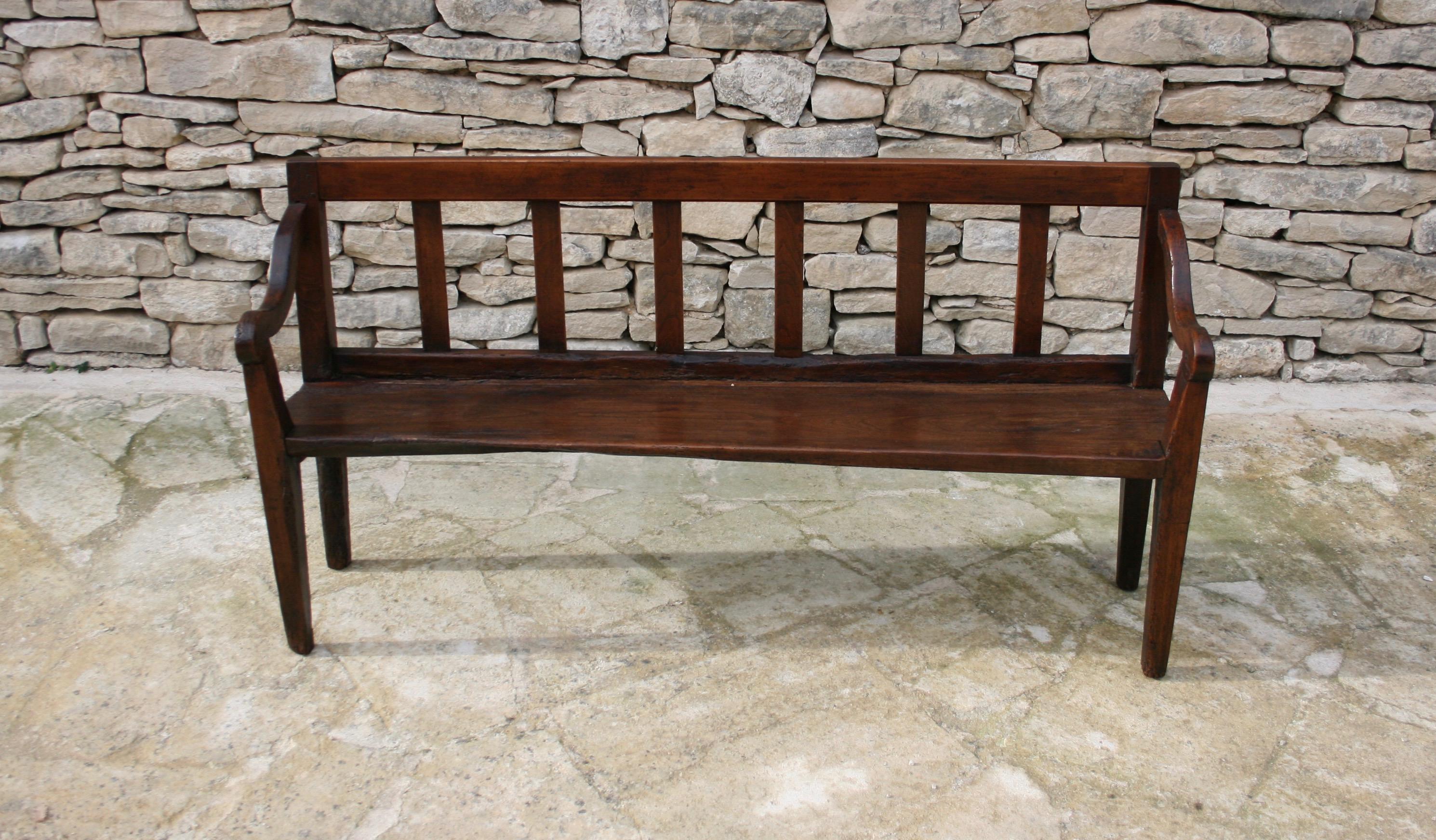 A delightful example of English country house furniture, a wonderfully proportioned small hall bench. Made from a mix of both chestnut and walnut, the piece has wonderful age and patina. Would work equally well in a boot or mud room or hallway or