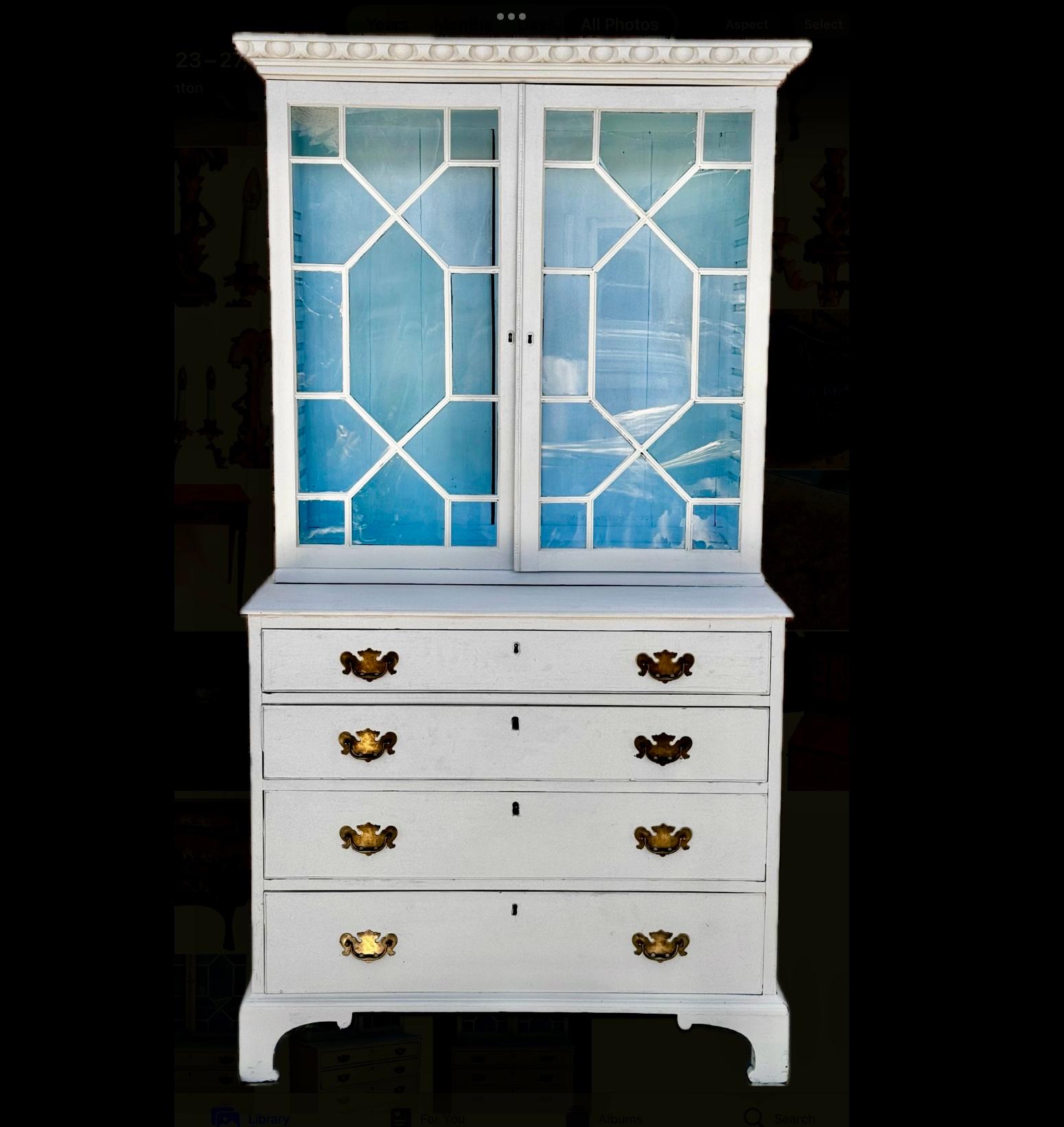 Early 19th Century English Georgian Painted Secretary Bookcase. This Bookcase Secretary is a beautiful two piece unit with two upper glazed doors. one adjustable shelf, and four graduated drawers below. Piece has polished brass hardware and is