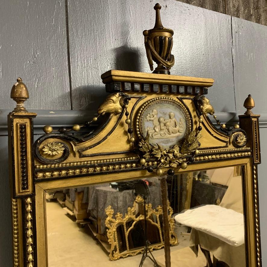 Interesting early 19th century gilt pier mirror with a Regency style and also the Wedgewood plaque to the pediment.
Very decorative mirror and has great detail to the frame. The frame has been over gilded at some point in its lifetime and also