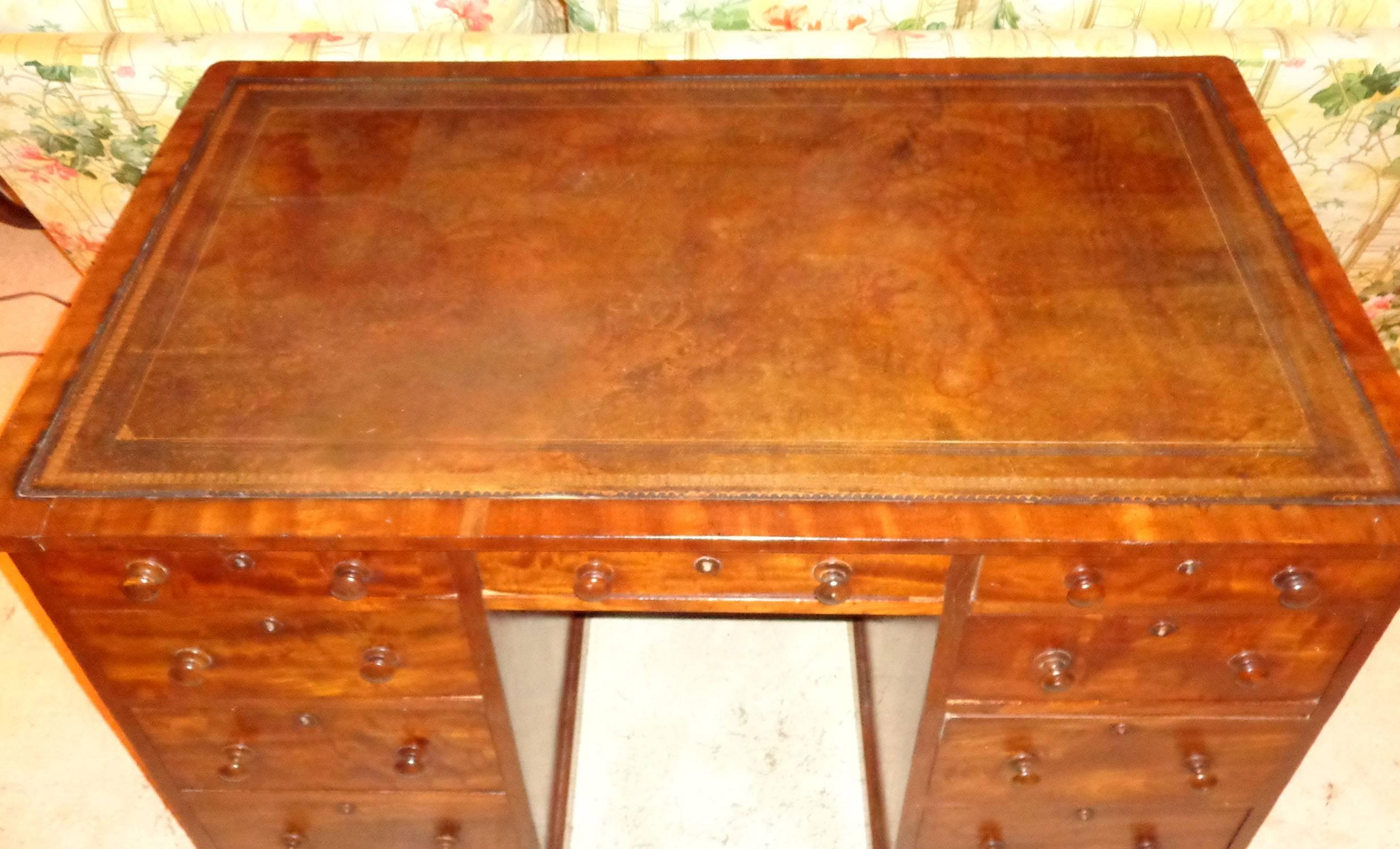Rare English faded mahogany knee-hole map desk with original wooden knobs. Purchased from one of Europe's (Belgium) best known antiquarians and world renown designers, Axel Vervoordt. Formally in the Elizabeth Gertz collection.