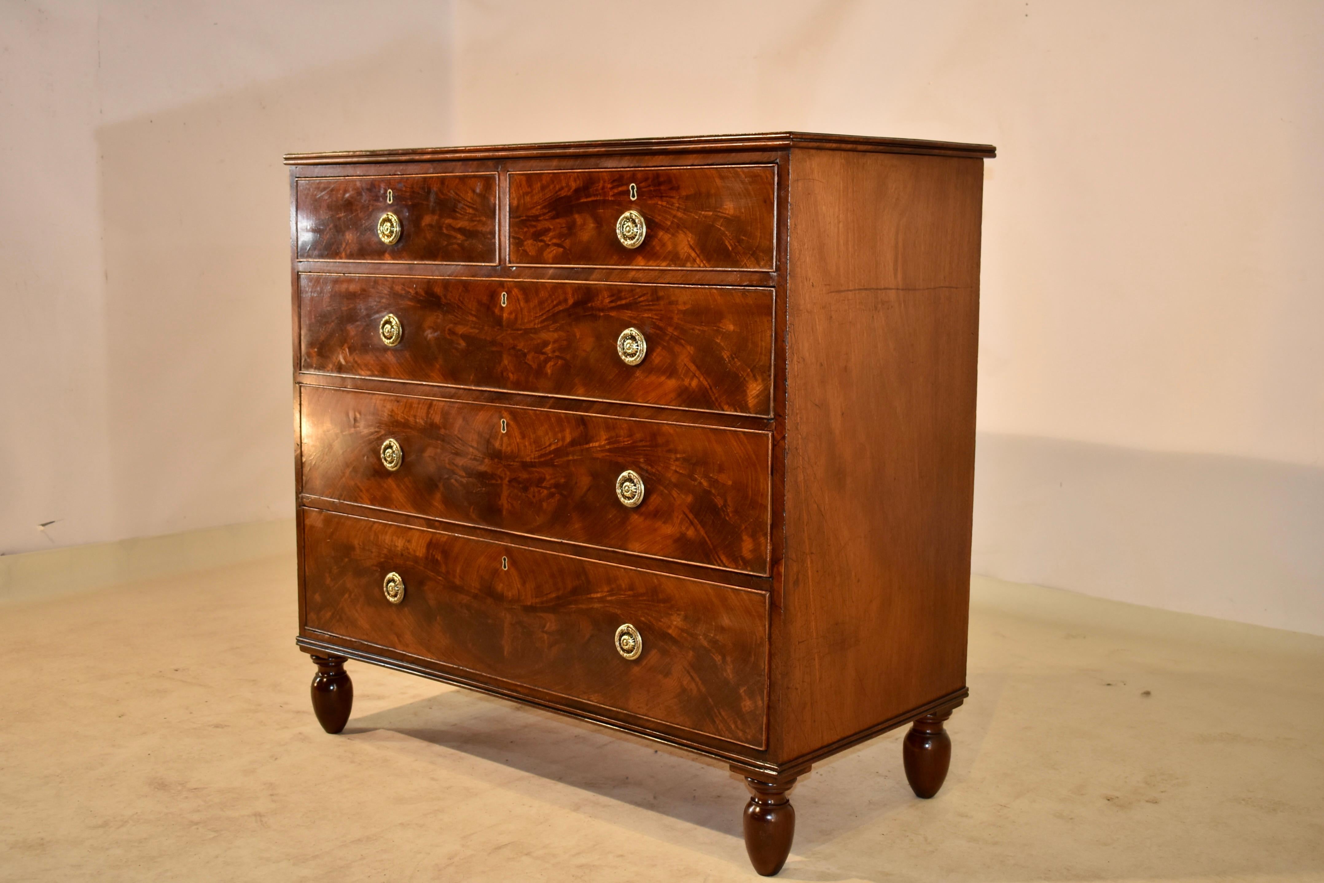 Early 19th century mahogany chest of drawers from England with a wonderfully grained and richly patinated top with a reeded edge, following down to simple well-grained sides and two drawers over three drawers in the front. The drawer fronts are all