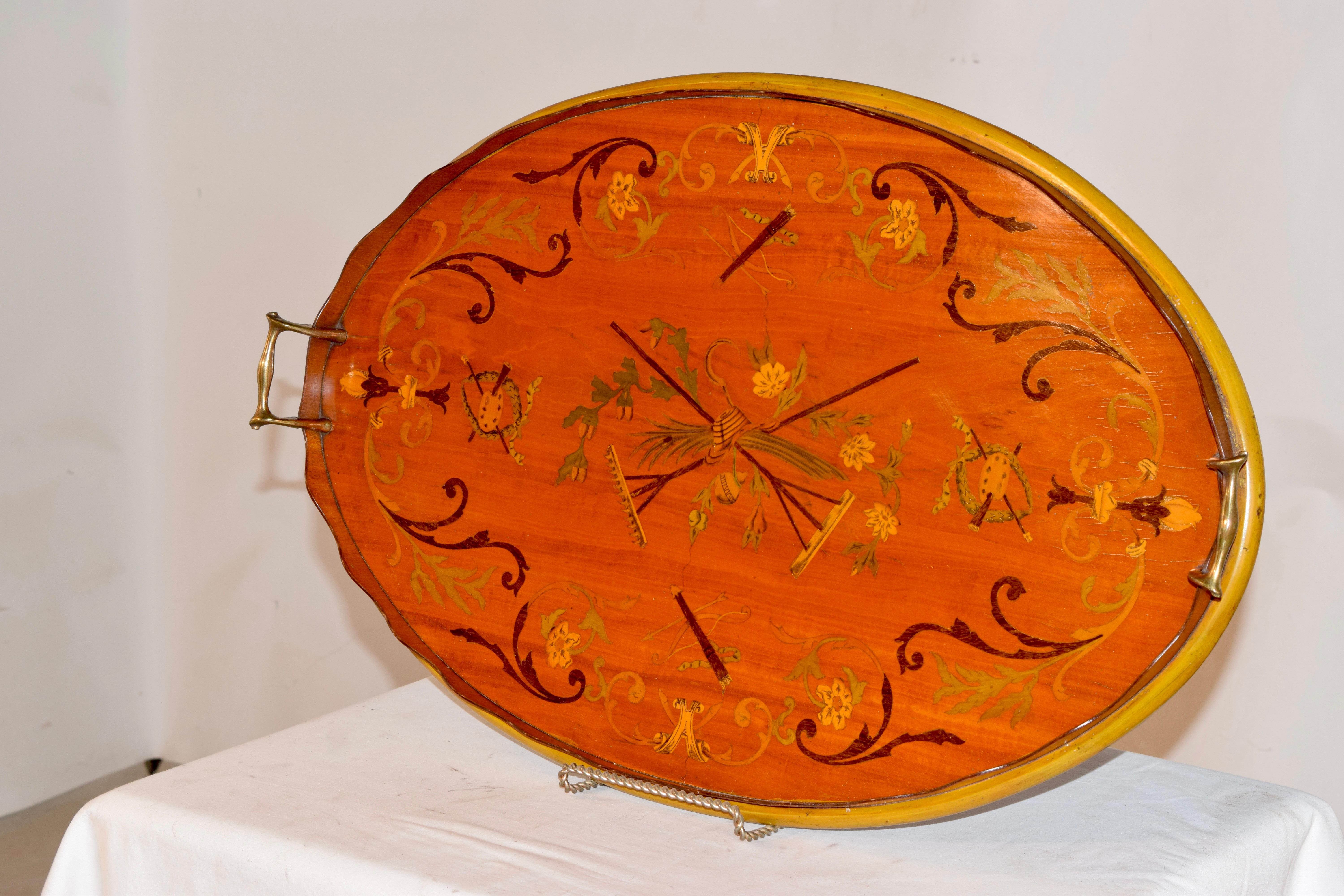 19th century wonderful quality Georgian mahogany tray with a scalloped gallery surrounding a beautifully inlaid central gardening design with crossed implements, which are flanked by wreaths surrounding artists palettes and surrounded by wonderfully