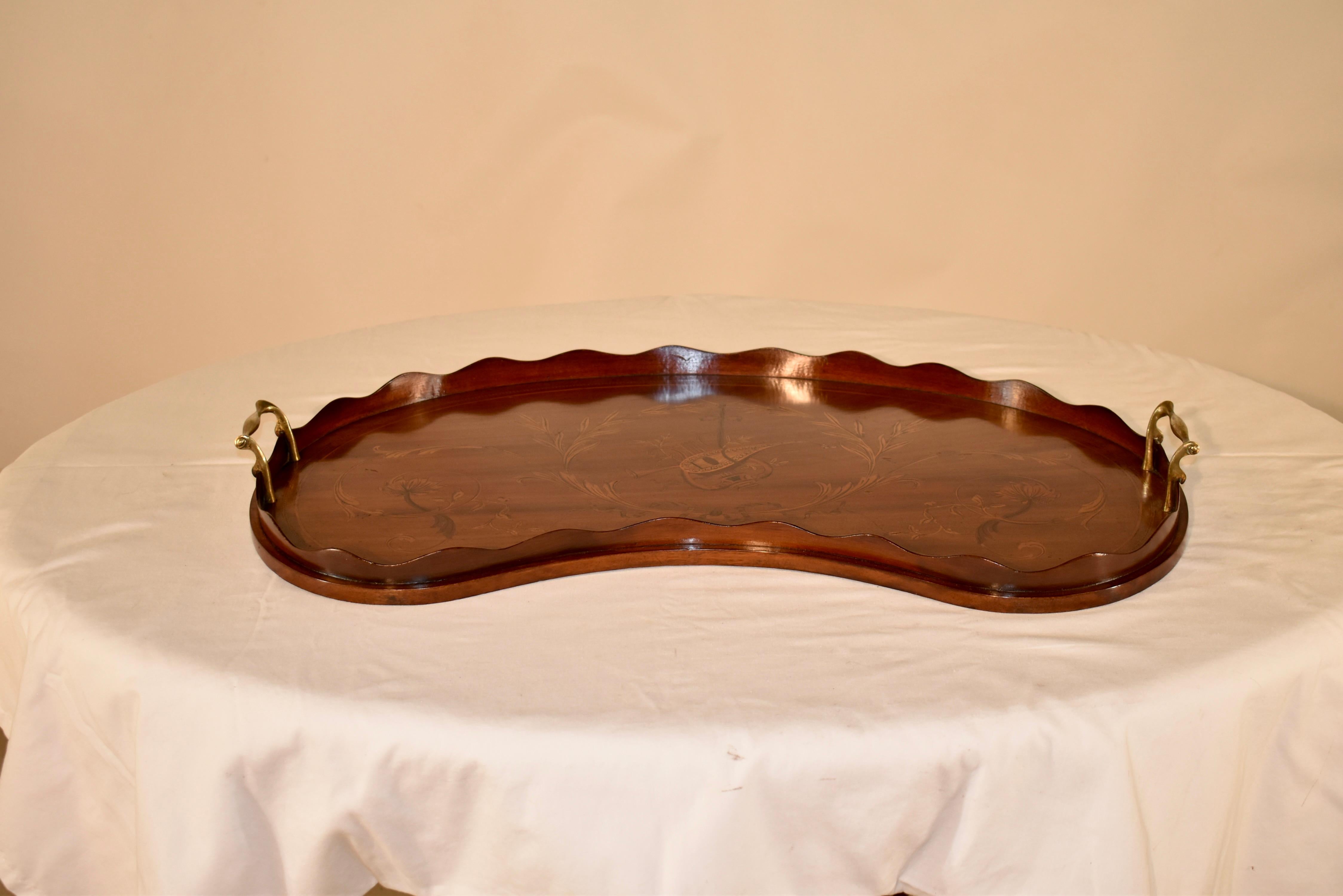19th Century wonderful quality Georgian mahogany tray with a scalloped gallery surrounding a beautifully inlaid central music design with crossed instruments and surrounded by wonderfully inlaid leaves, vines and bell flowers. Flanked on either end