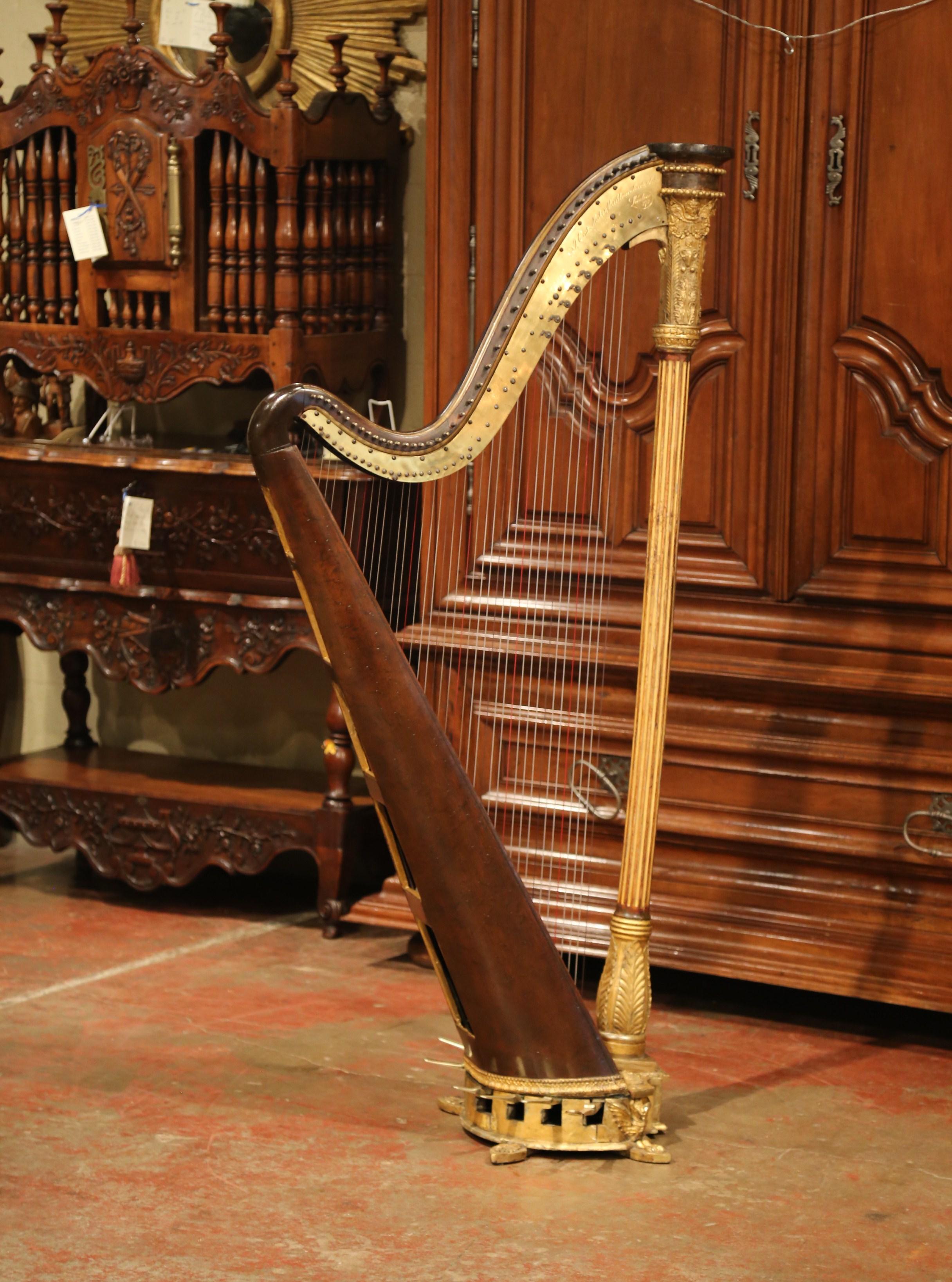 Decorate a living room or a boudoir with this elegant antique Regency pedal harp. Crafted in England by Jacob. Erat, London circa 1820, the double action musical instrument features 42 recently replaced strings to the gilt foliate faux rosewood