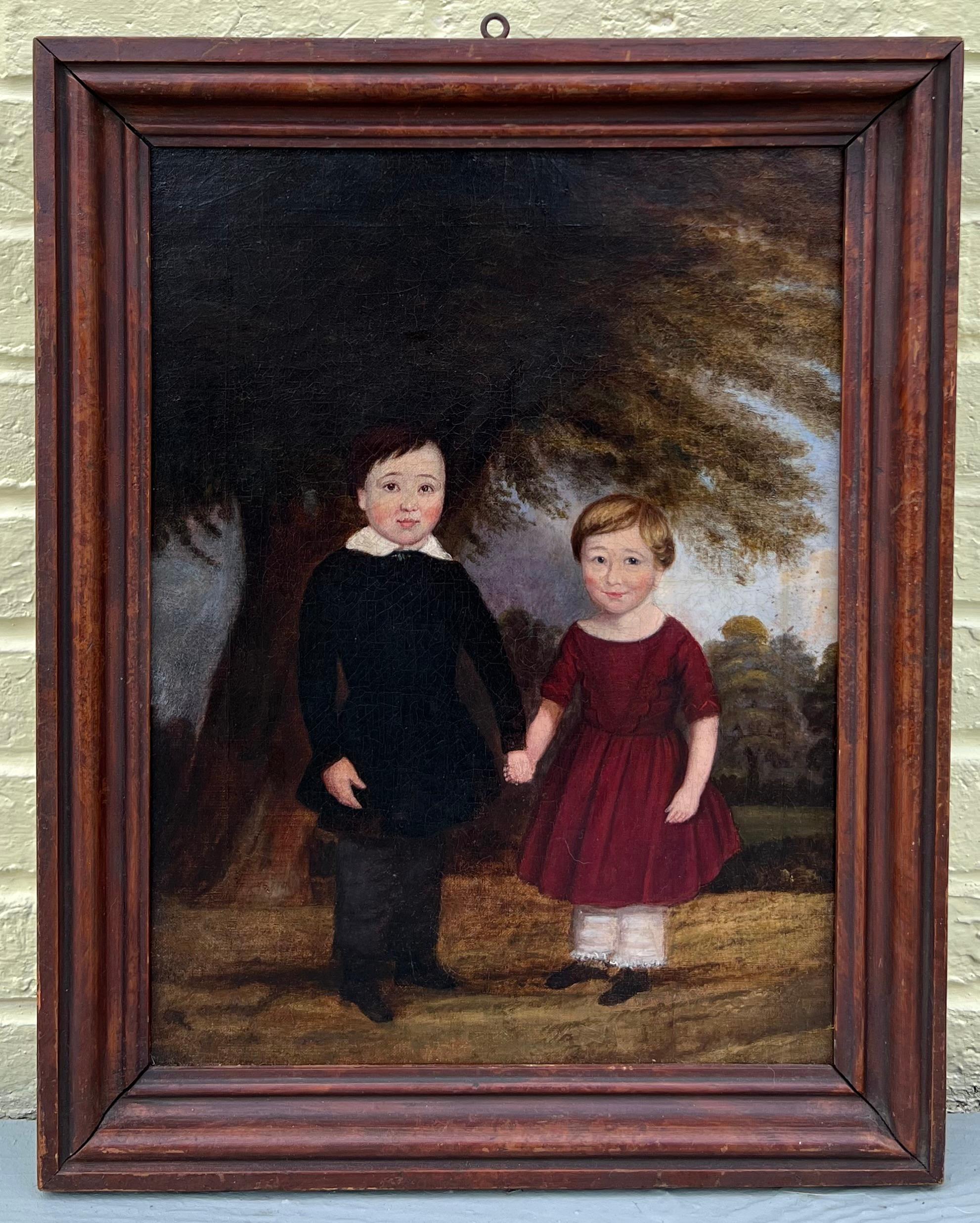 Charming early 19th century British folk art painting of two happy children in a landscape. Oil on canvas and presented in a period, if not original, wood frame. The painting has been professionally conservation cleaned and is ready to hang.