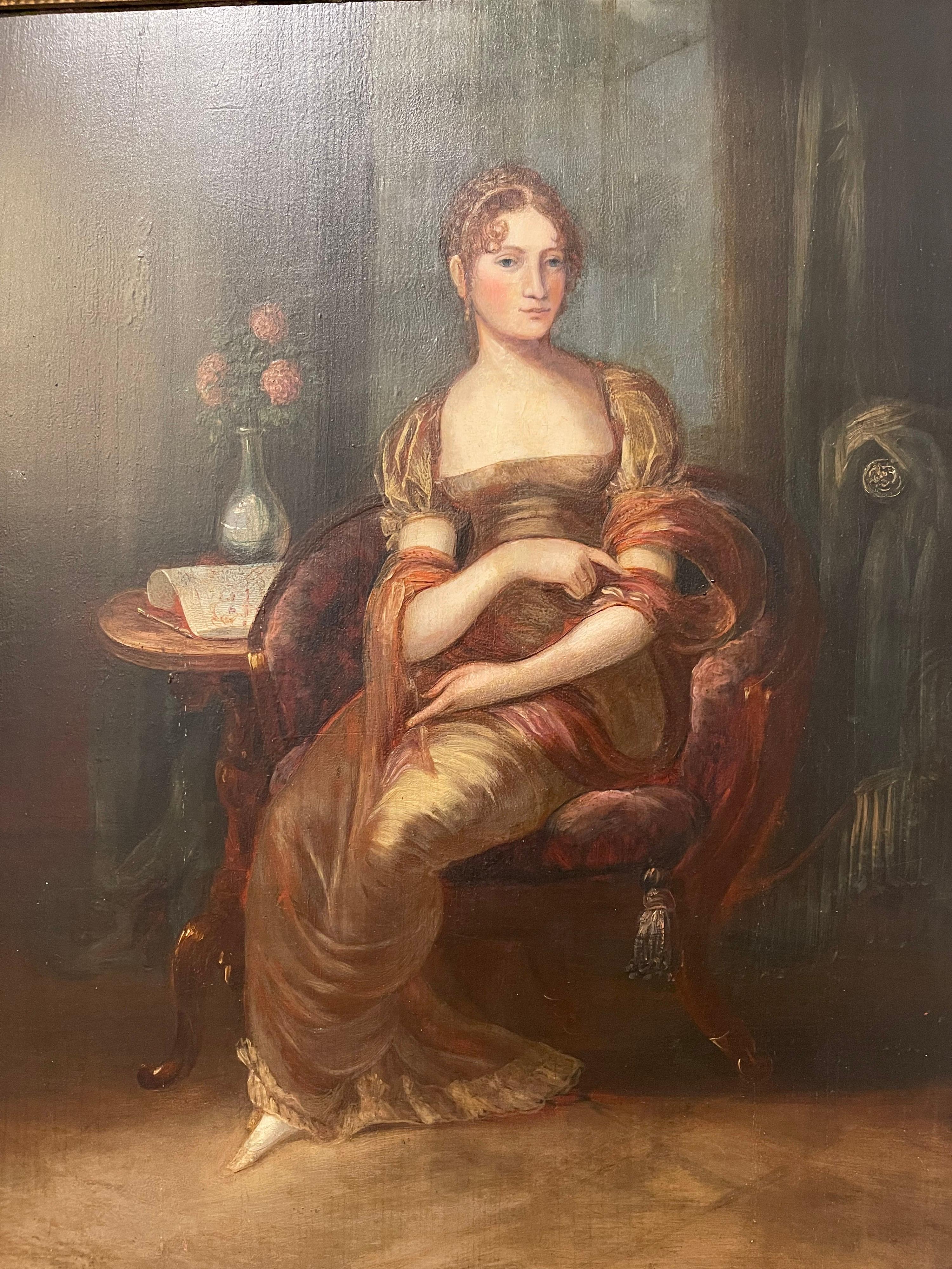 Paire de portraits anglais du début du 19e siècle de la période Regency. Portraits en pied d'un mari et d'une femme dans un cadre domestique, huile sur panneau de bois. Elles sont toutes deux encadrées dans leur cadre doré d'origine. Le dos des