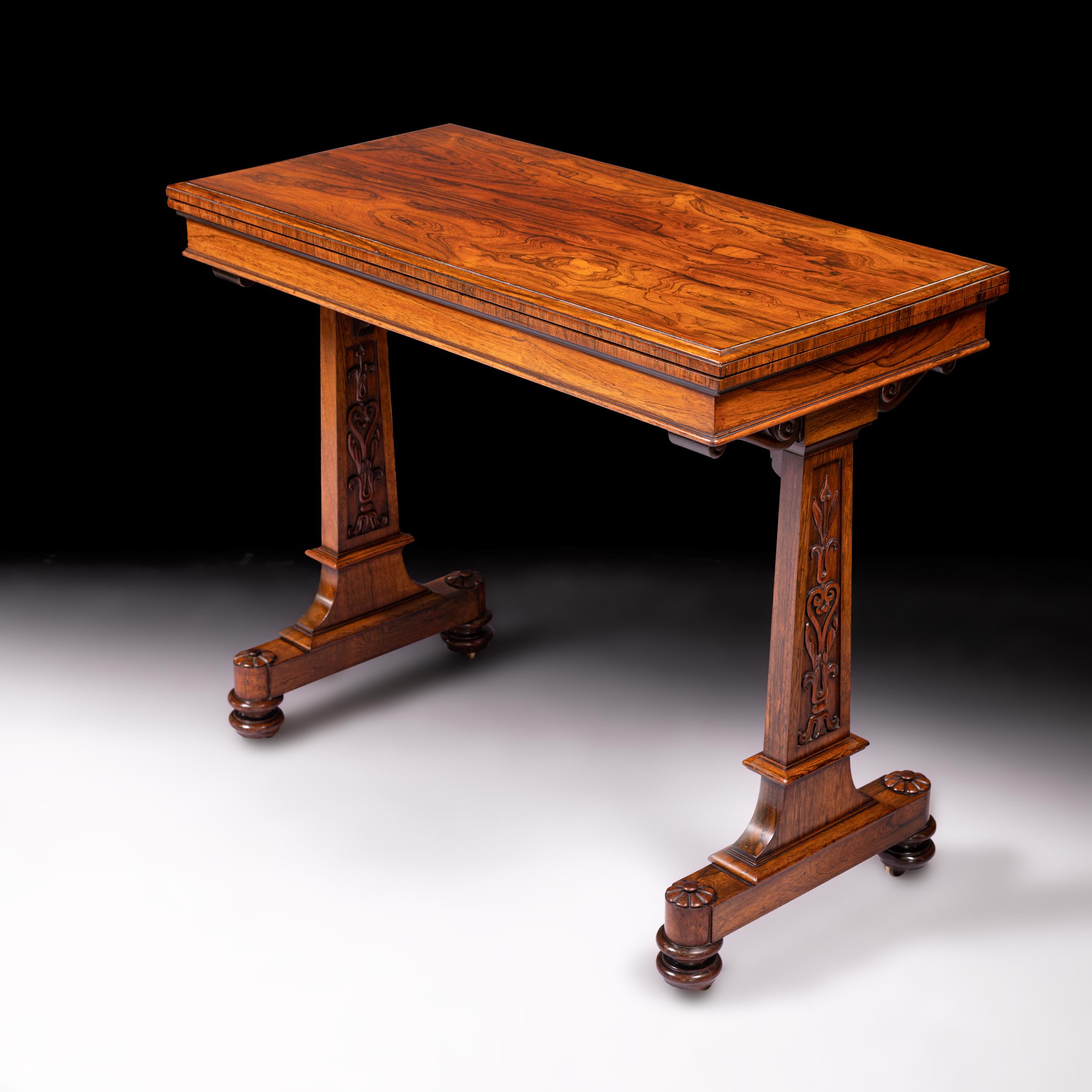 A fine quality William IV rosewood card table stamped T & G Seddon with moulded edge and swivel top, silhouette end supports and raised on turned legs with castors. The legs pull in towards the centre of the table when the table is open, allowing