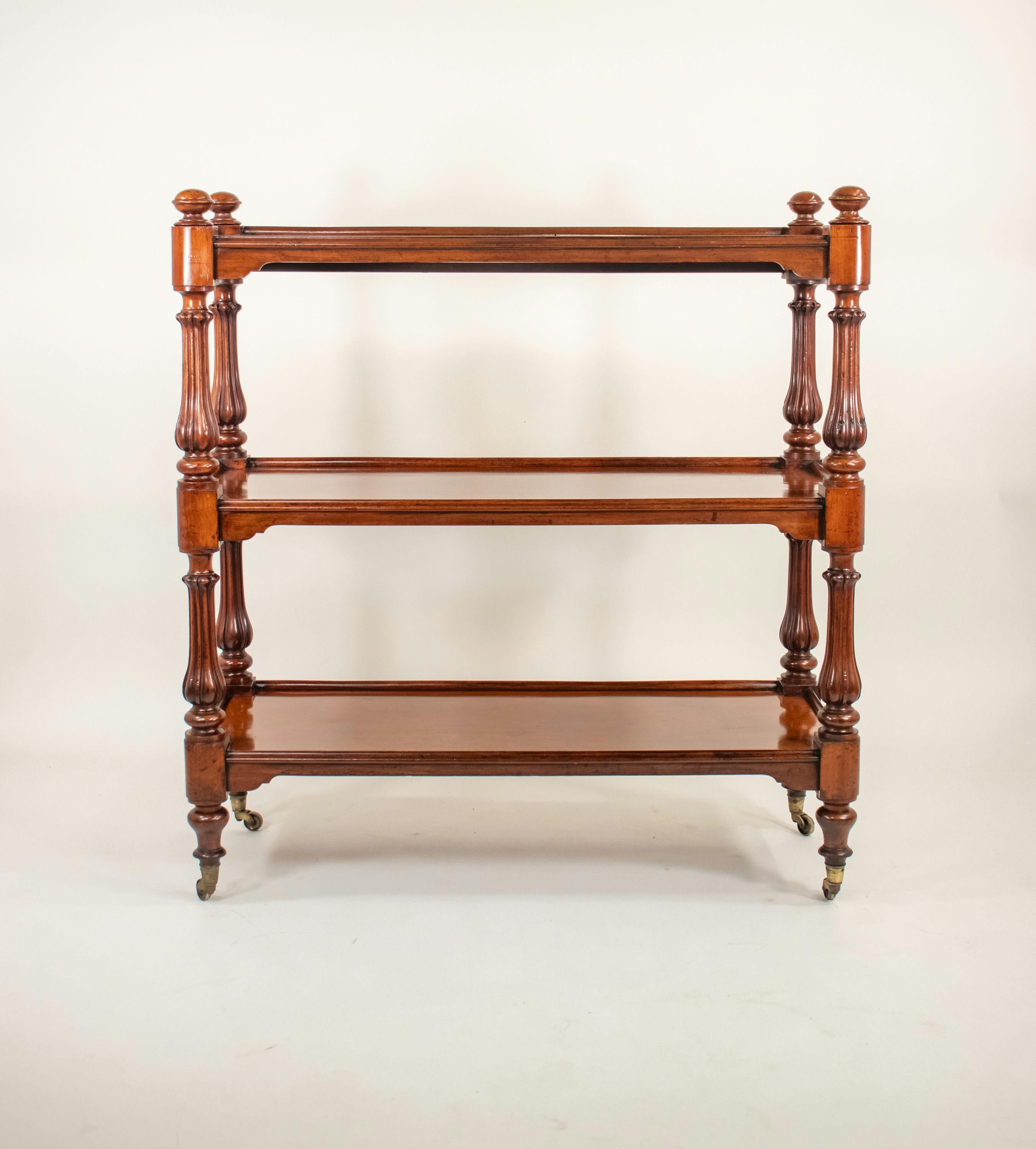 This hand-crafted solid mahogany server offers three tiers of elegant table space. The term 