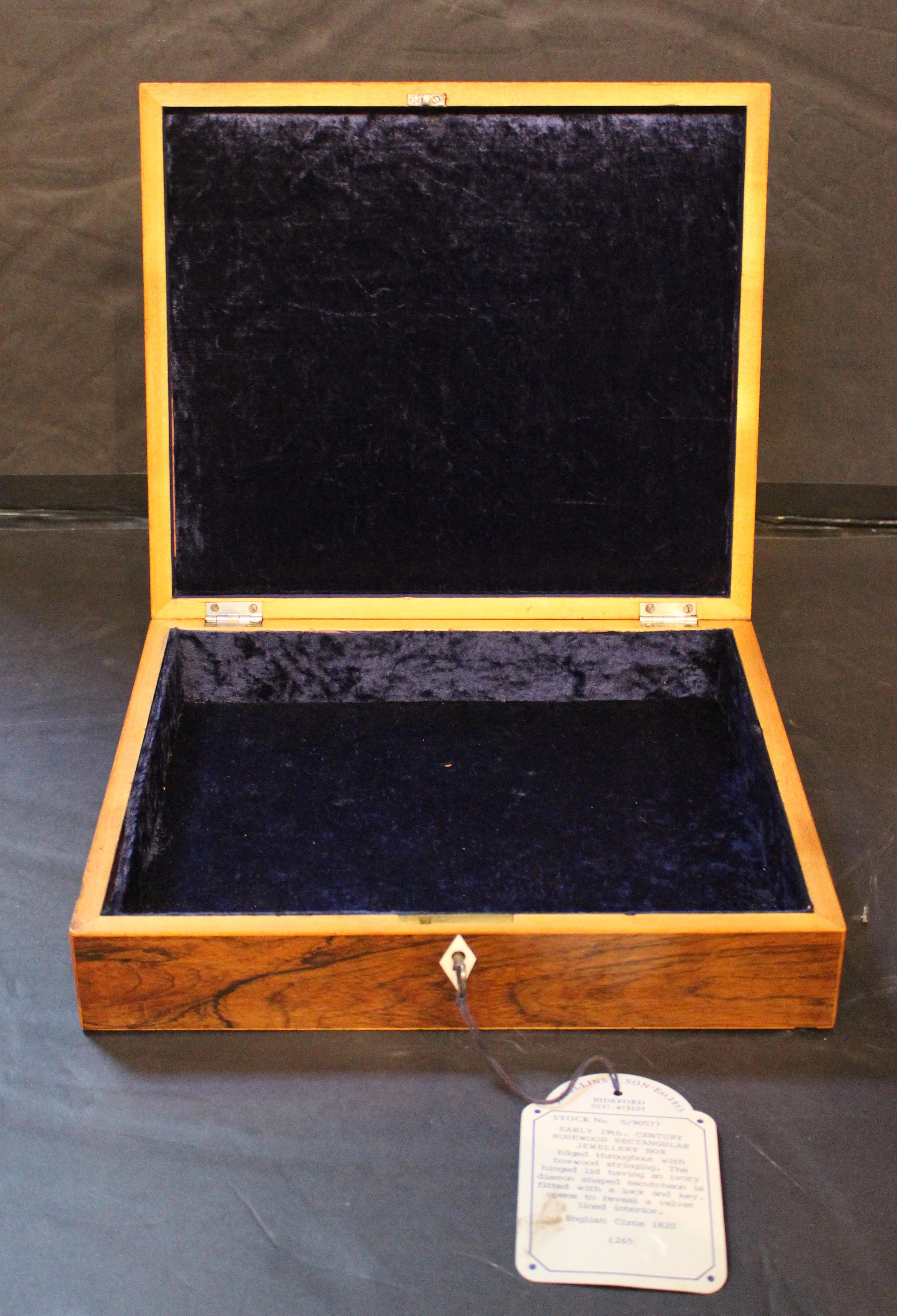 Early 19th century Regency period jewelry box, English. Rosewood with boxwood edging. Deep blue velvet lining. Diamond escutcheon. Original tag of J. Collins & Son, CINOA, BADA & LAPADA members. Collection of Dr. John Fryer, London & Chapel