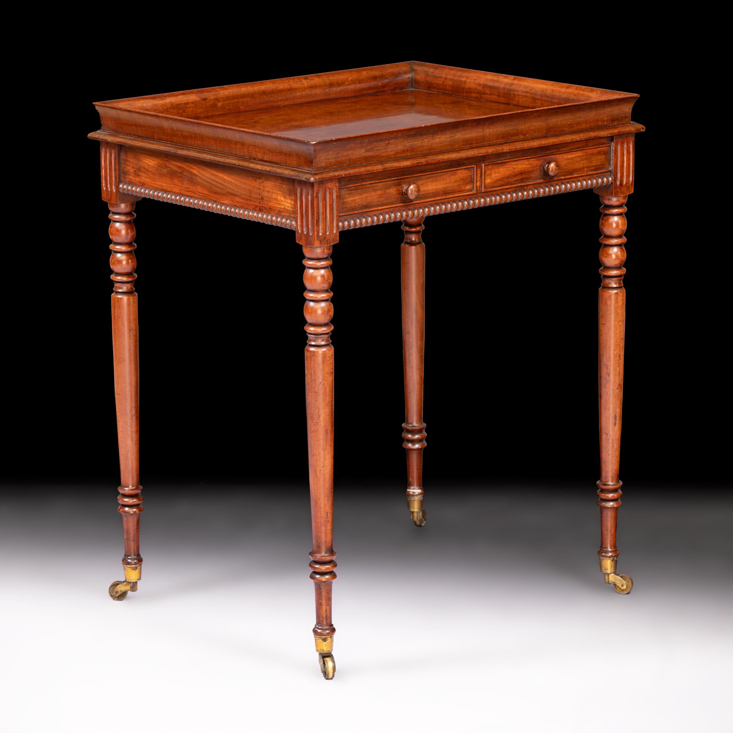 A fine Regency mahogany occasional table attributed to Gillows of Lancaster, with tray top above frieze drawers and beaded border, on turned tapering legs with castors.

Circa 1828

English