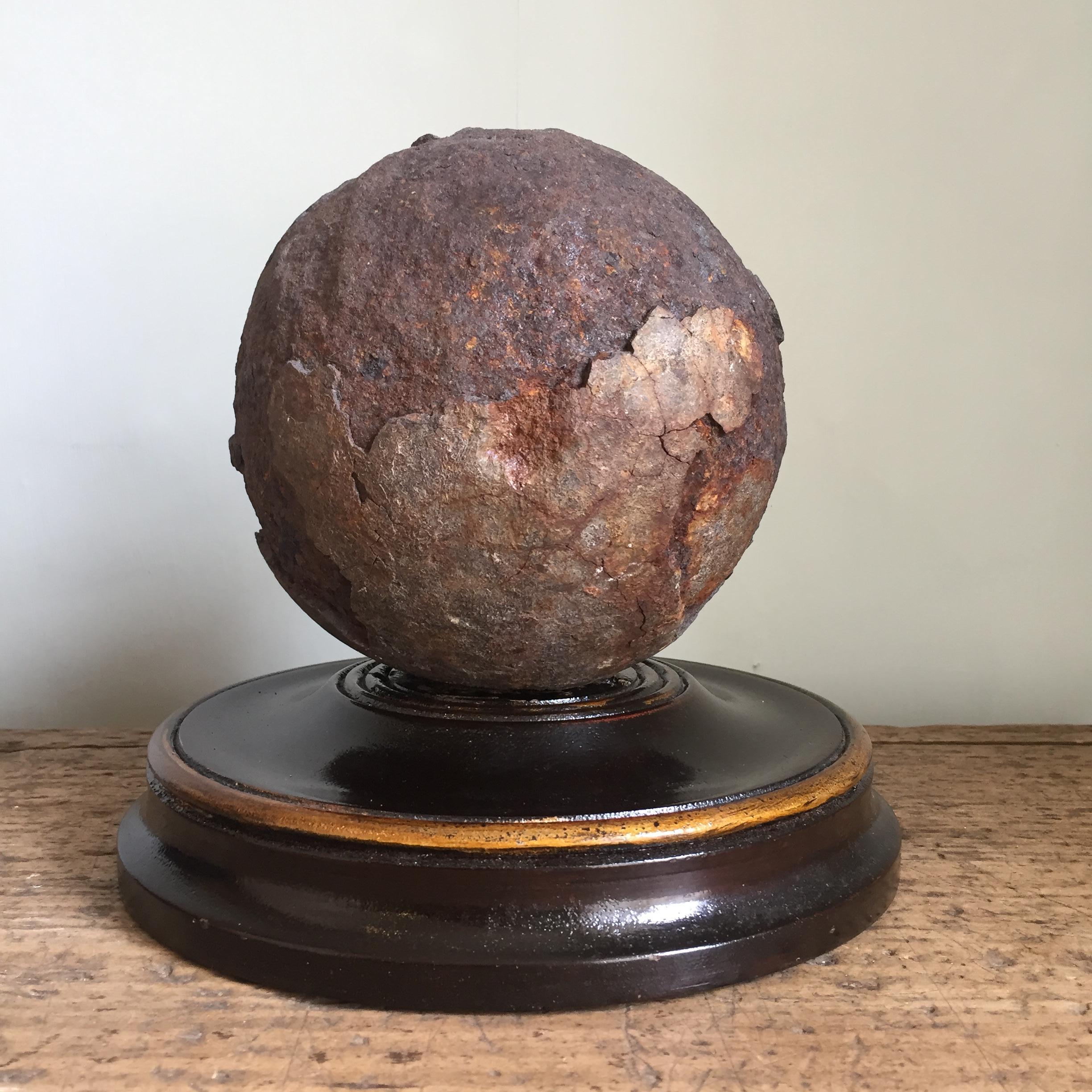 Georgian Early 19th Century English Relic Cannonball on a Turned Wooden Base For Sale