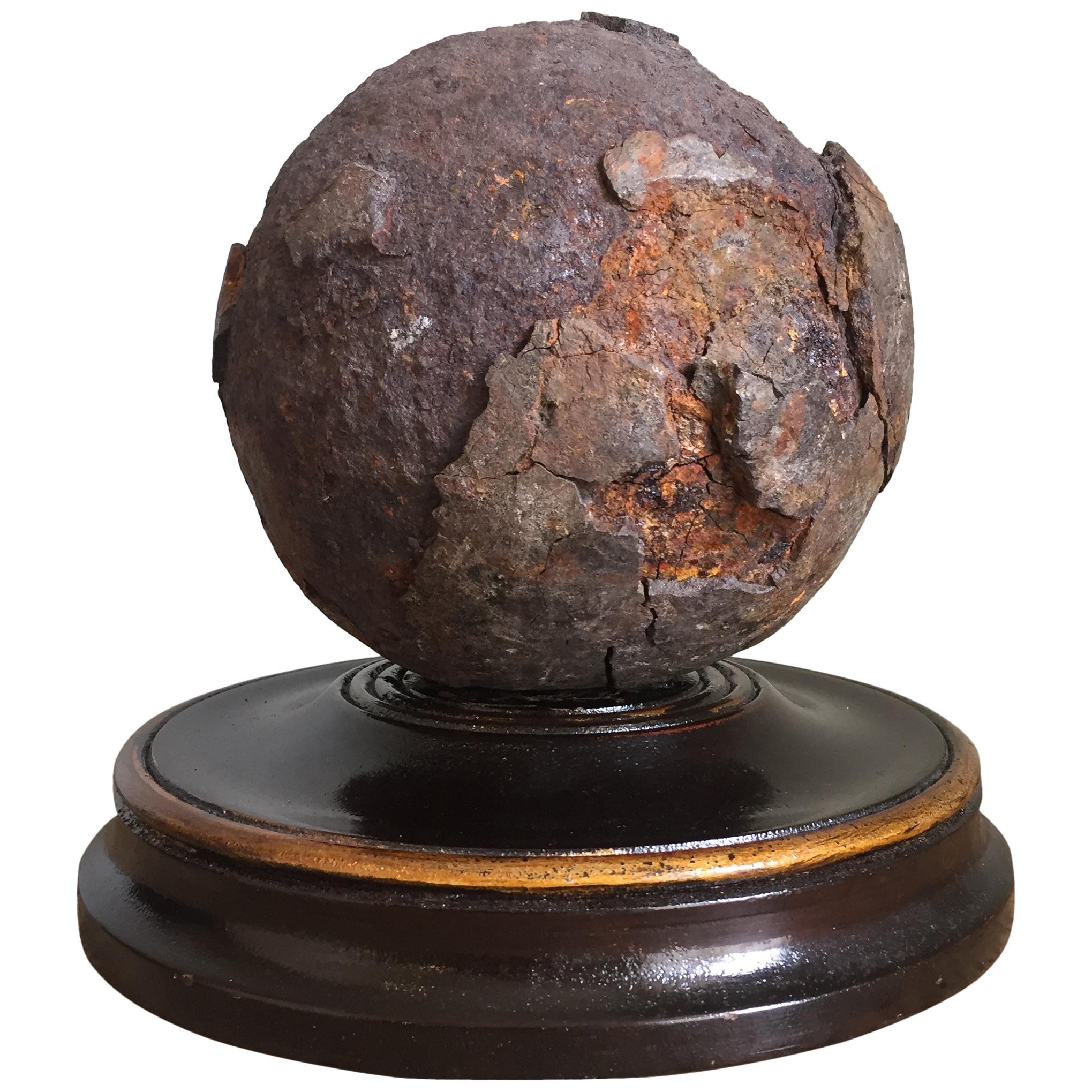 Early 19th Century English Relic Cannonball on a Turned Wooden Base For Sale