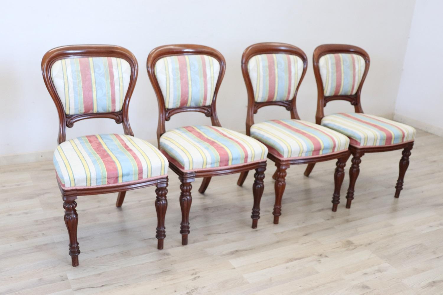 Series of four refined 19th century authentic English Victorian mahogany wood four chairs. The legs are very elegant with carved wood decorations. The seat is wide and comfortable in goods conditions. Antique goods conditions.

 