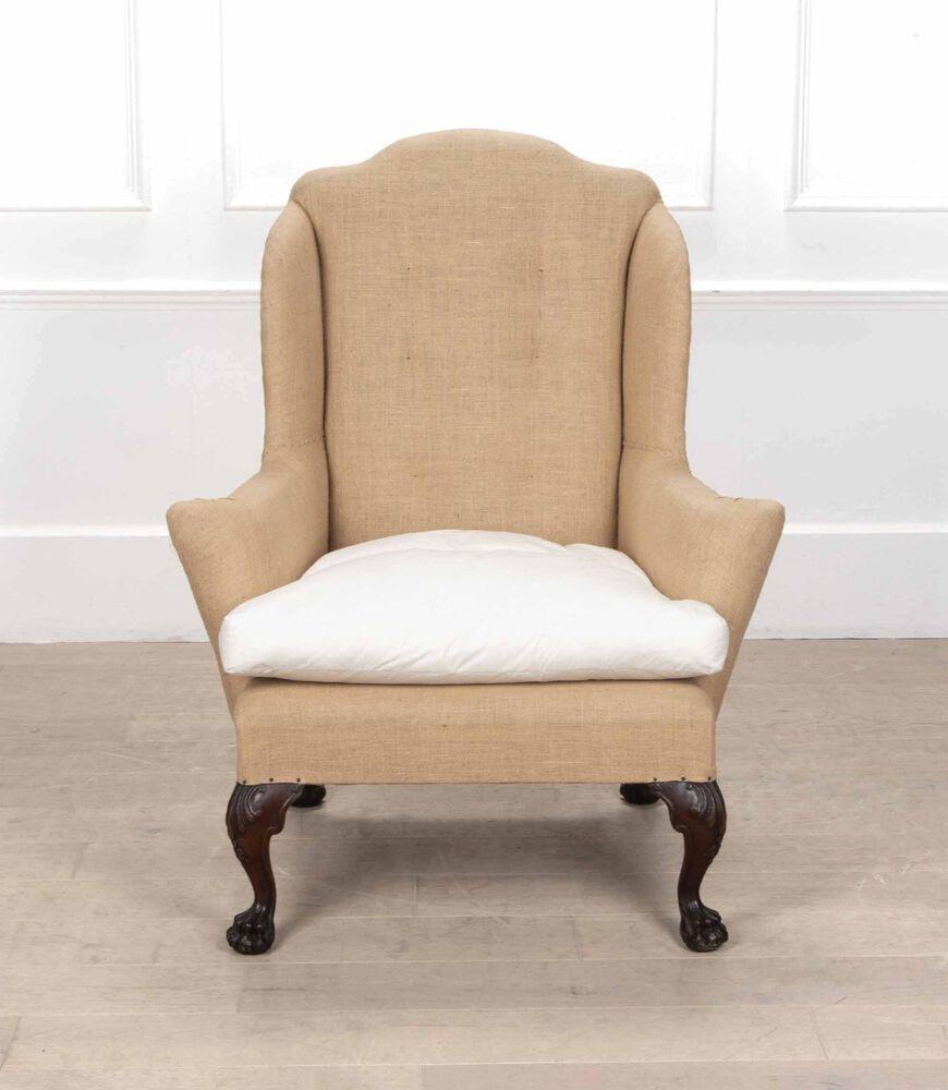 Early 19th Century English mahogany wing chair with ball and claw feet.
Covered in hessian and ready to be reupholstered.