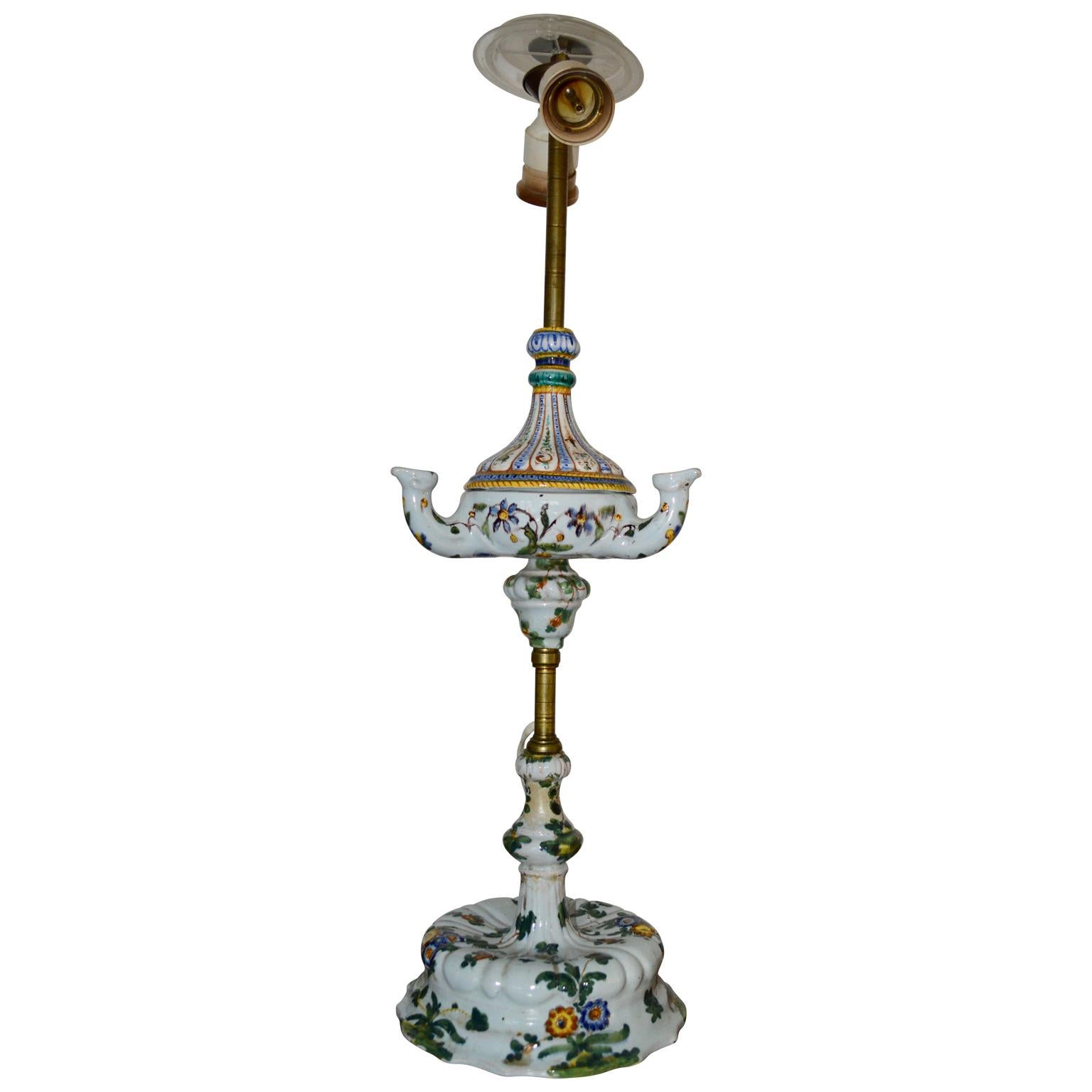 This 19th century faience table lamp is converted from an old oil lamp.
