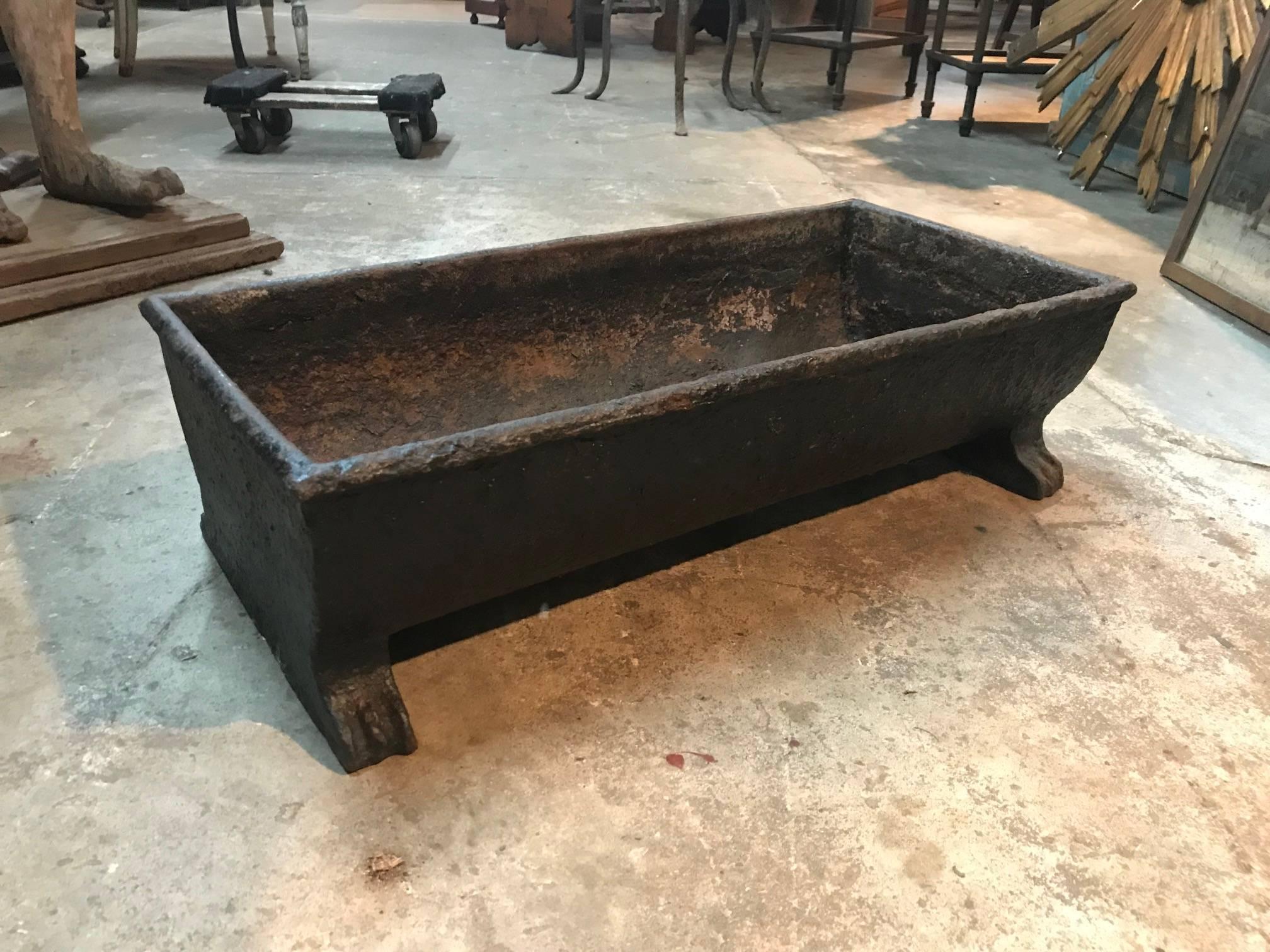 An early 19th century Feed Trough - Pig Trough from the South of France - in cast iron. Troughs such as these serve beautifully as jardinieres, planters or incorporated into a water feature.