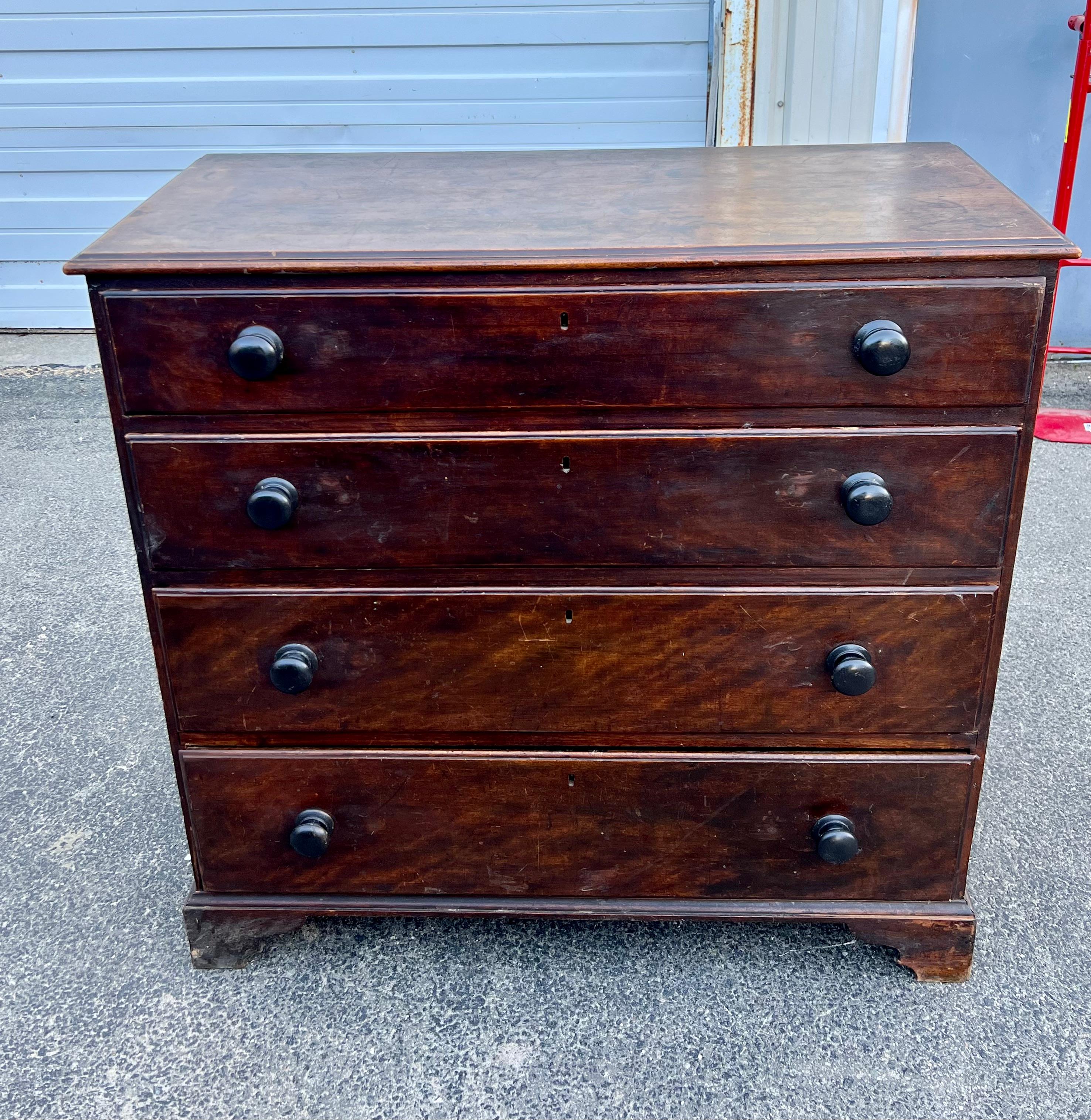 Early 19th century Flame Birch chest of drawers.  With original stain and lovely grain, four graduated drawers with beaded drawer fronts and turned knob pulls, on ogee bracket feet.  From Nova Scotia.