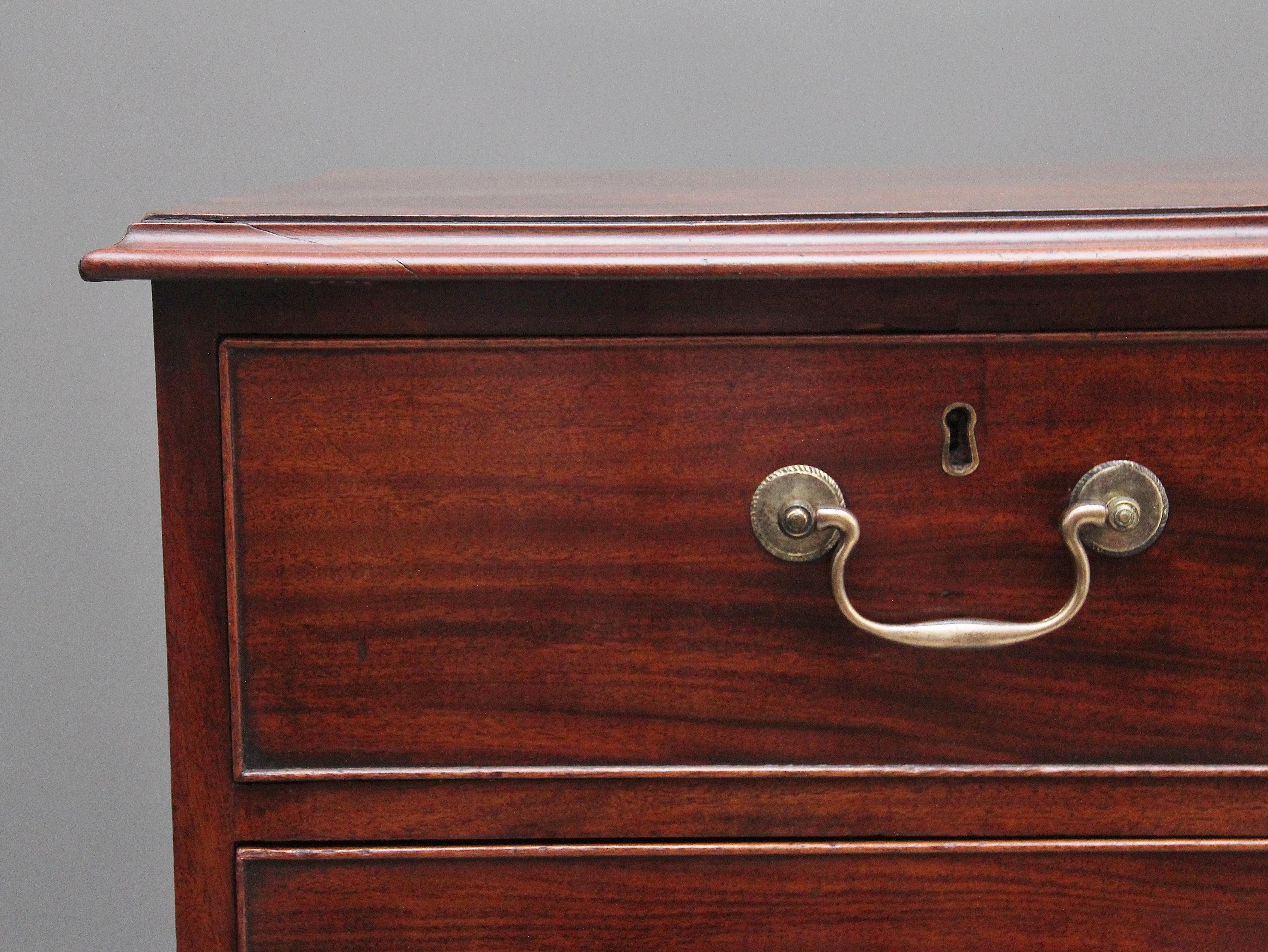 Early 19th Century flat fronted mahogany chest of drawers, having a nice figured moulded edge top above a selection of two short over three long graduated oak lined drawers with the original brass swan neck handles and escutcheons, supported on