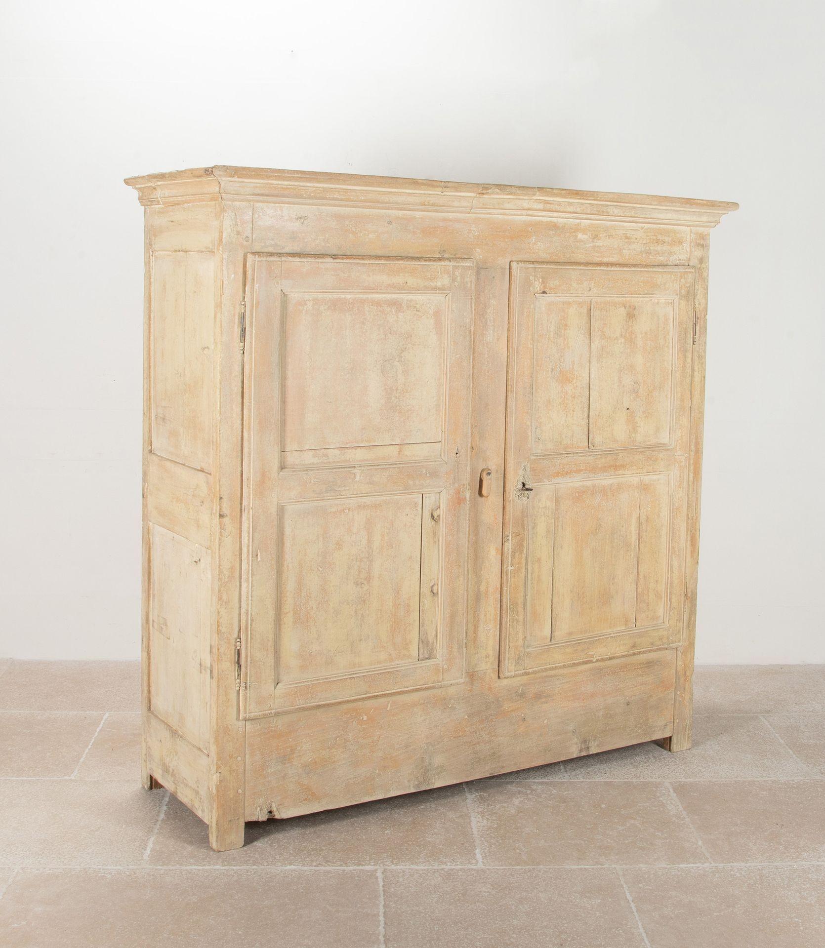 Early 19th Century French armoire from the mountains.
In a lovely 'dry' finish. With panelled doors and sides with shelved interior.