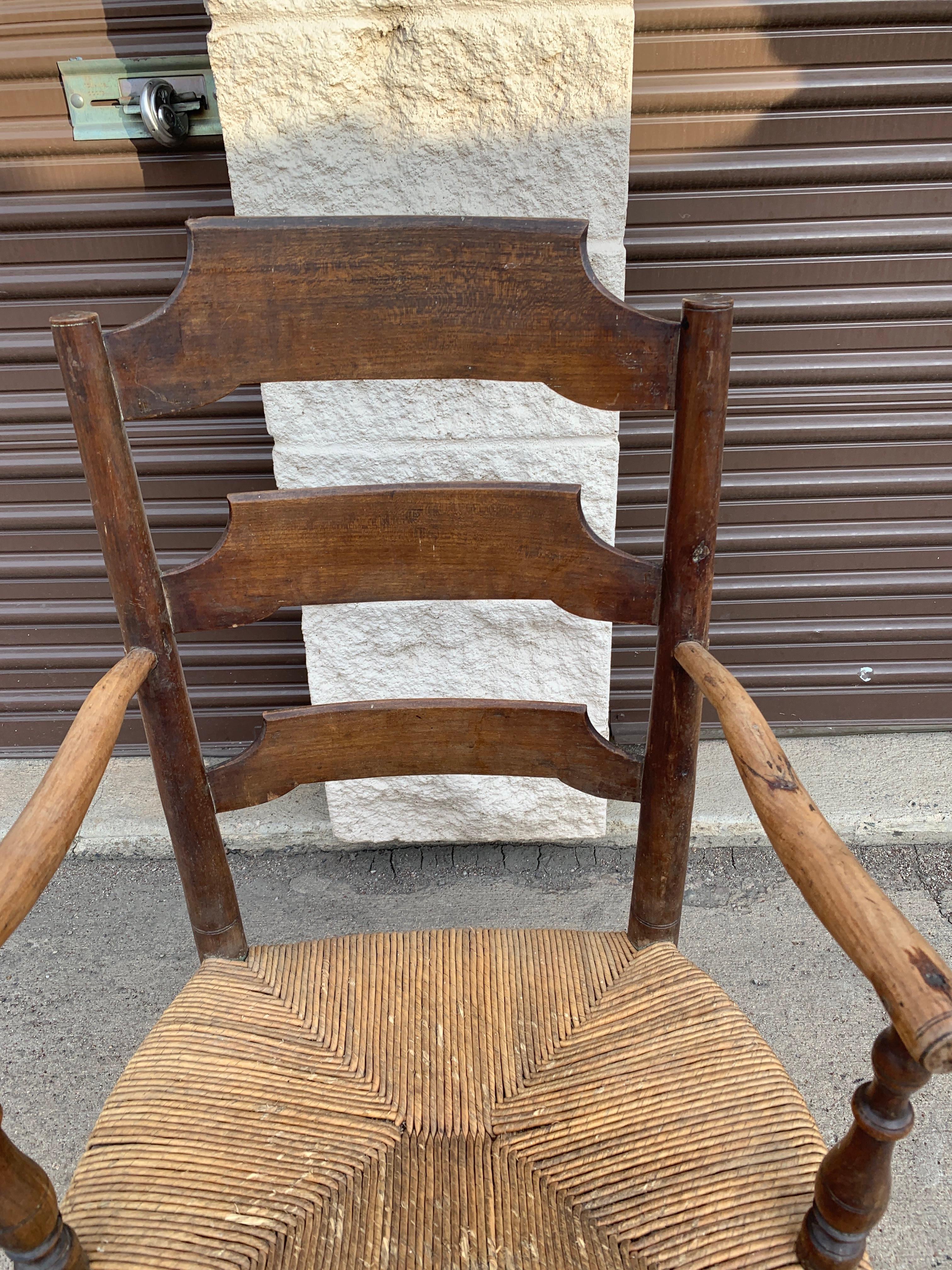 French Provincial Early 19th Century French Ash Wood Rush Seat Armchair For Sale