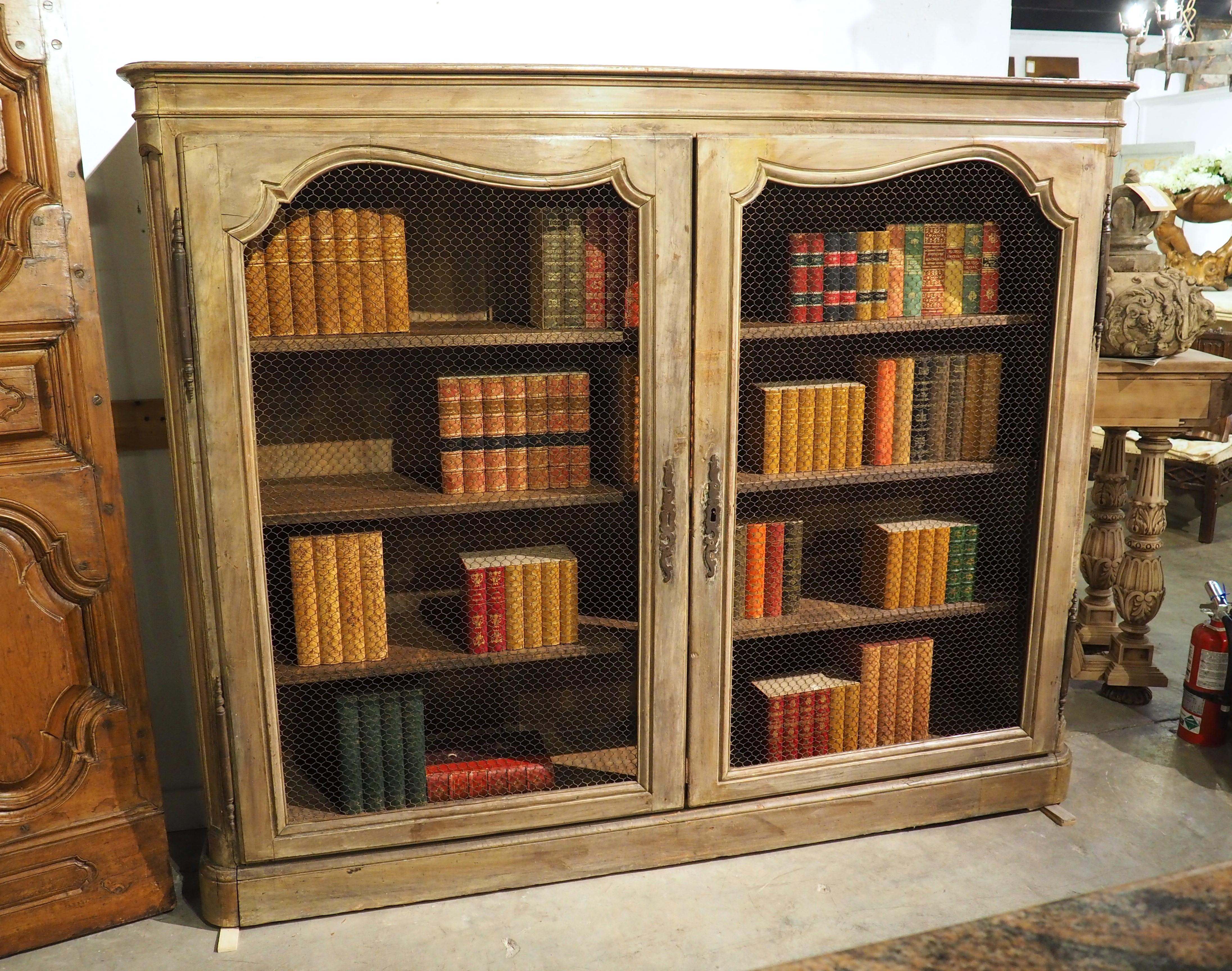 Hand-Carved Early 19th Century French Bibliotheque Cabinet with Wire Mesh Door Panels