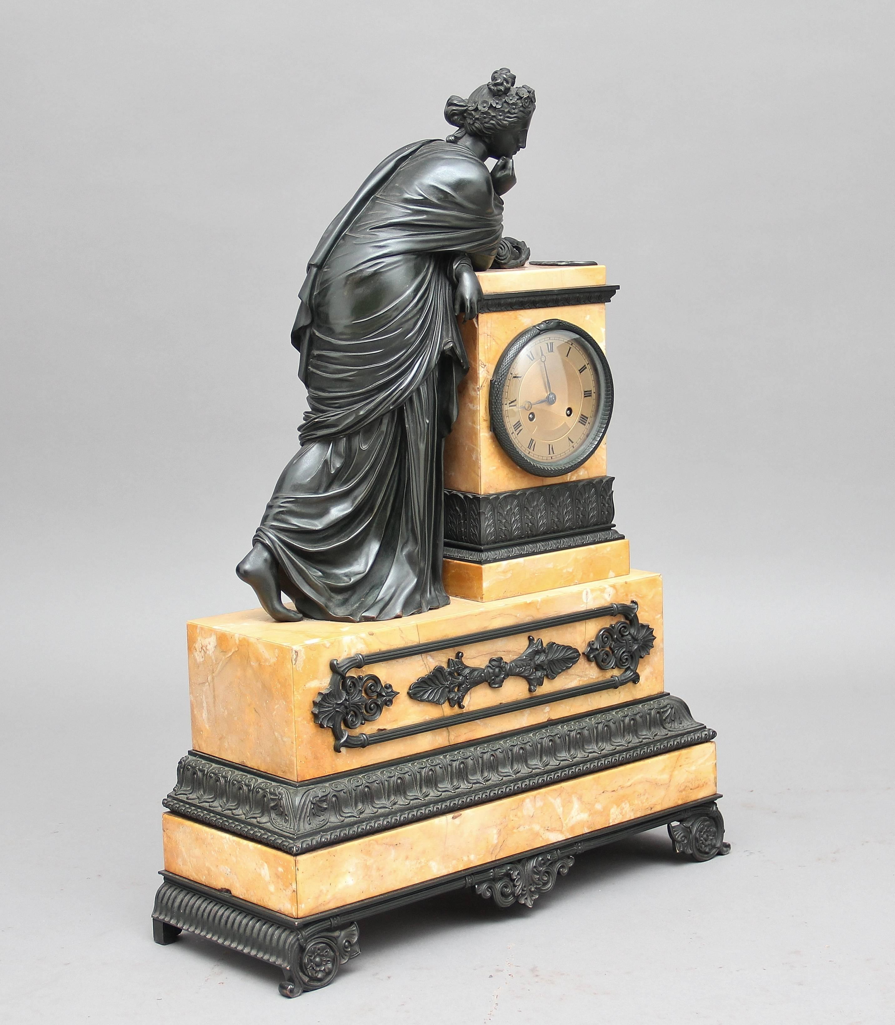 A fabulous quality French bronze and marble mantle clock, this imposing clock is of a classical Greek maiden leaning on a marble column that incorporates the clock, the lady and the column are on a marble plinth standing on bronze feet, the marble