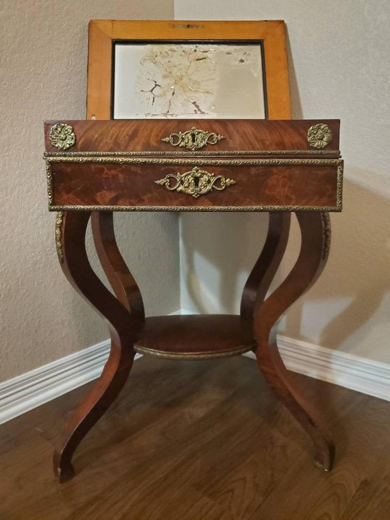 A scarce period Charles X (1818-1834) French  Restoration mahogany travailleuse sewing (thread stand - side table - jewelry dressing table) with light, warm, beautifully aged patina. 

Born in France in the early 19th century, almost certainly