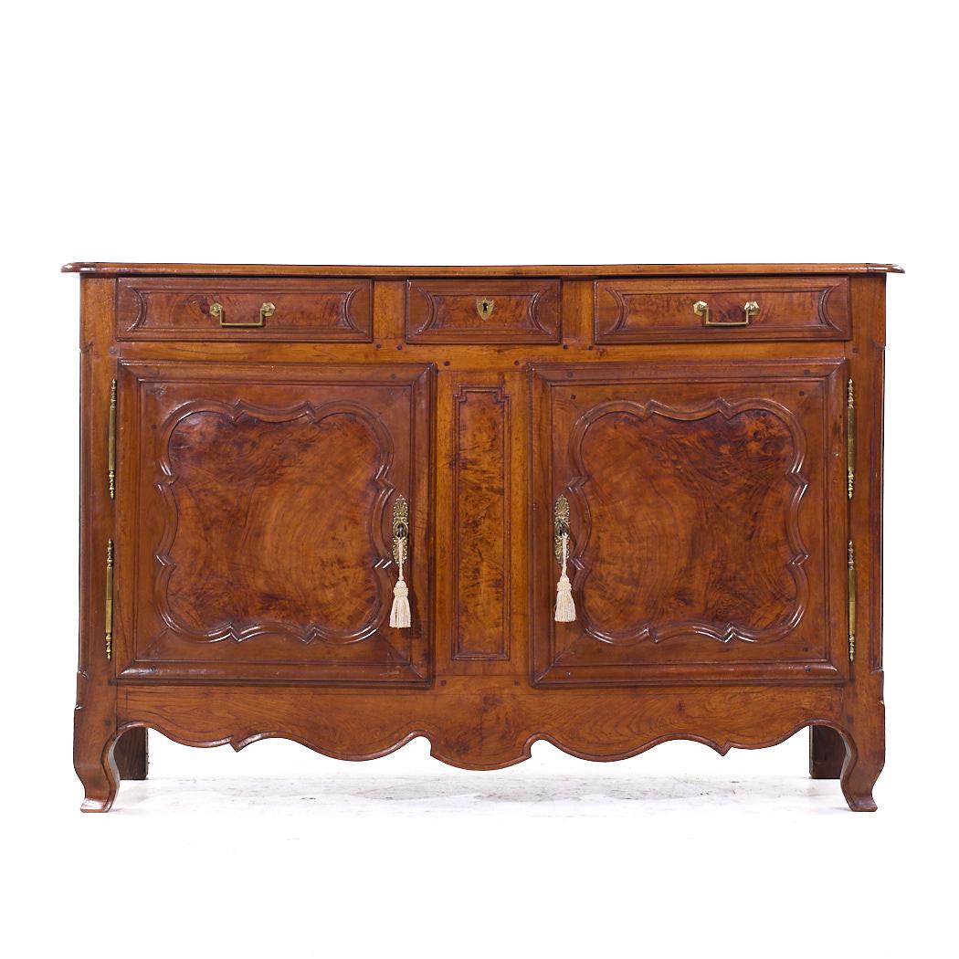 Early 19th Century French Cherry Wood Cupboard Dresser

This cupboard measures: 62.25 wide x 20.75 deep x 40.25 inches high

We take our photos in a controlled lighting studio to show as much detail as possible. We do not Photoshop out