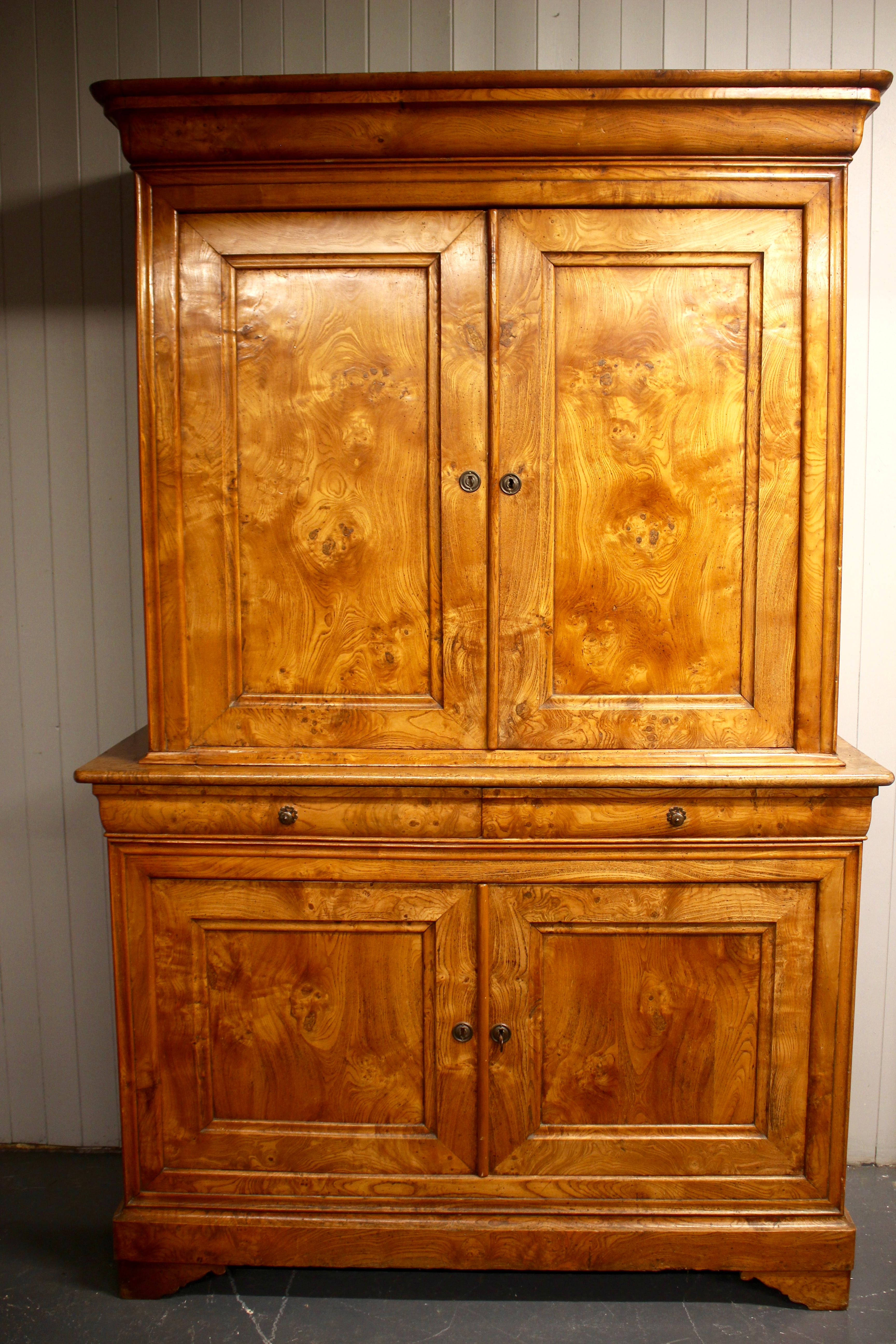 A delightful antique French chestnut cupboard or cabinet. Having beautiful classical lines with a wonderful color and grain. Topped with a Classic cyma recta cornice above panelled doors and sides enclosing fitted shelves. The centre section holding