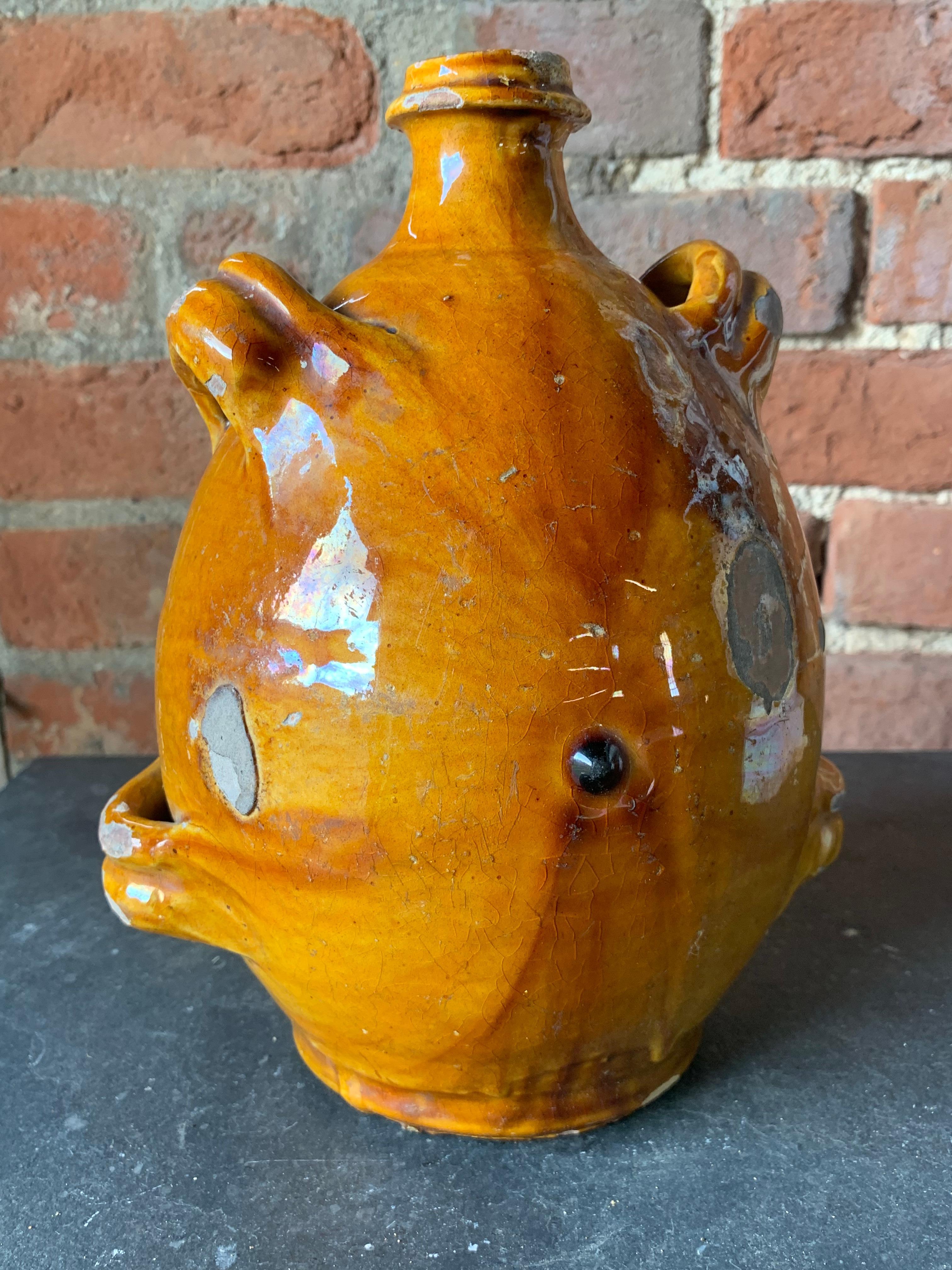 A rare and beautiful late 18th early 19th century French Conscience vessel which were used for carrying water. This one has the most wonderful vibrant colour glaze making it a very decorative and collectable piece.
Please contact us for a worldwide