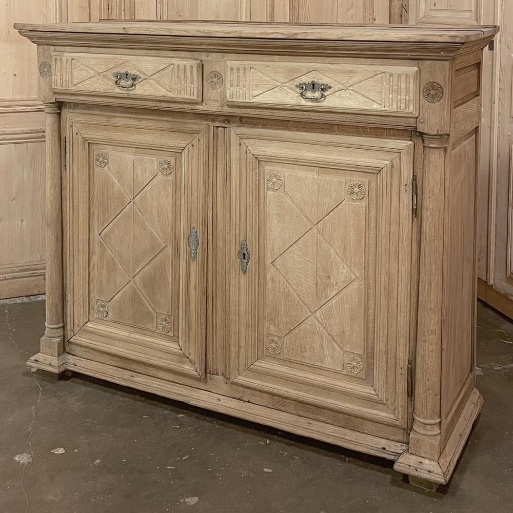 Early 19th century French Directoire Period stripped oak buffet is an historically significant piece, recalling the period as France transitioned out of the Empire style into a more staid architecture and level of embellishment that realized the