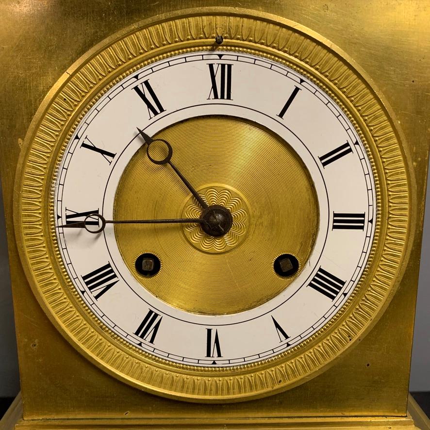 A very beautiful French gilt bronze Empire period 8 day mantle clock, circa 1830 and in lovely condition.
Beautifully made and real elegance to this style. The work to the dial itself and the central bezel is superb. 
The top of the clock has a