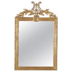 Miroir en bois doré à lyre et guirlande d'époque Empire français du début du 19e siècle