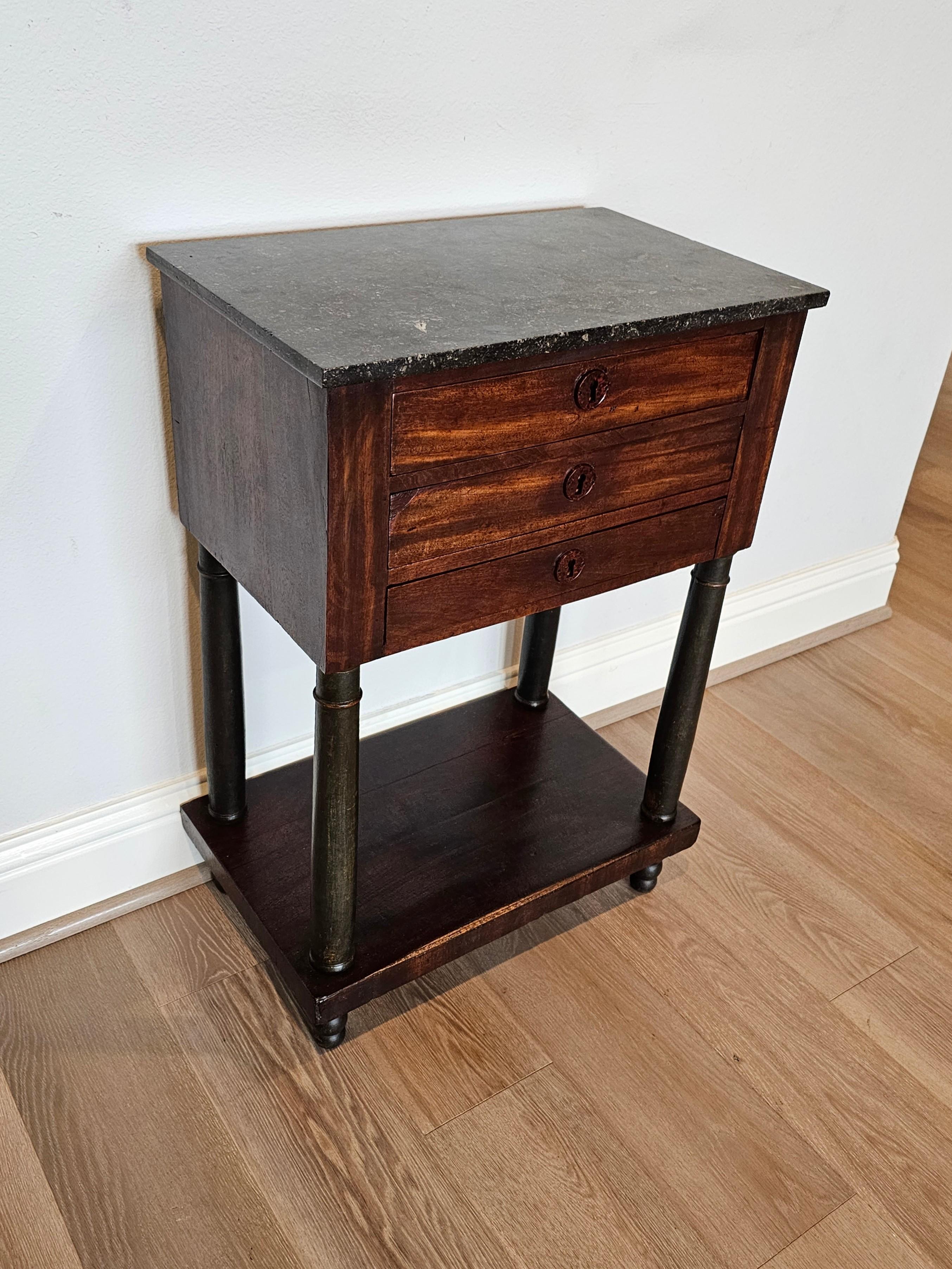 A period French Empire (1804-1815) mahogany chest of drawers nightstand with beautifully aged patina.

Born in France in the early 19th century, hand-crafted of warm rich solid mahogany with attractive grain detail, Napoleonic era Neoclassical Louis