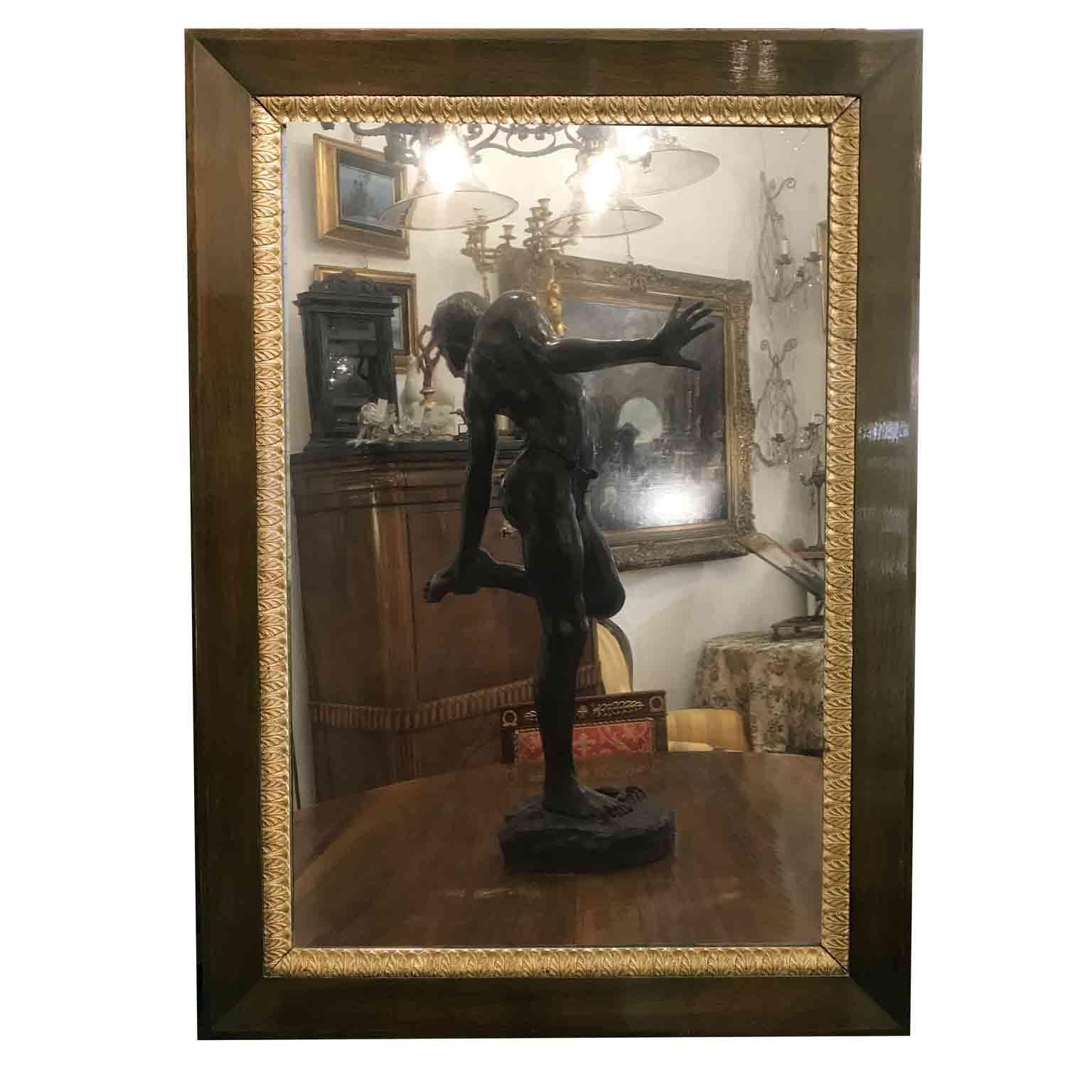 Early 19th century Empire mirror, a solid walnut rectangular frame decorated with a gilt plaster profile, a gilt gesso internal frame decorated with palmette, centered by an original mercury mirror. French origin.
Two lateral holes let us know this