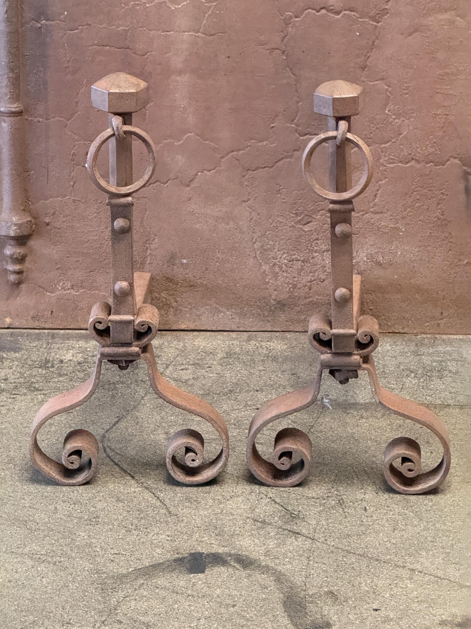 Early 19th Century French Louis XV Style andirons. Made of wrought iron. The andirons are in good condition and are fully functional.