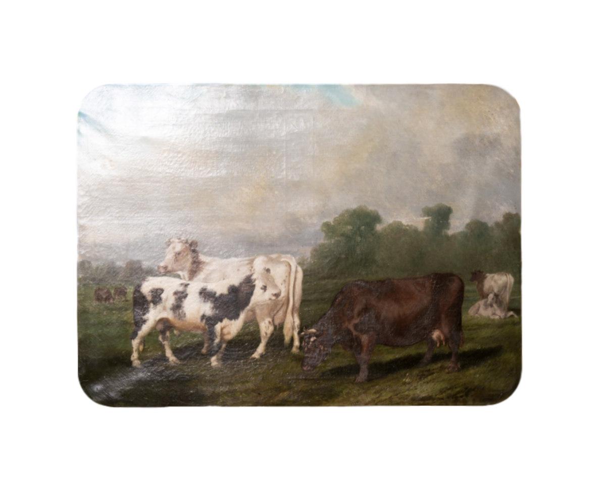 Exquisite antique French oil on canvas pastoral scene of cows, circa early 1800s. This serene painting depicts three cows at the forefront of a pasture and two in the back ground on each side. They all differ in color from each other, allowing the