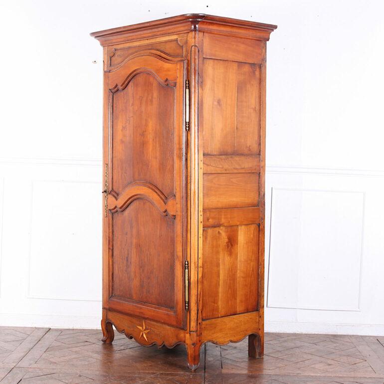 Gorgeous single door French cherry armoire or bonnetiere from the South of France. The little star at the bottom of this beautiful and very usual storage piece indicates the region of it’s origin…’Pau.’ Very rare. Great for clothing storage or linen