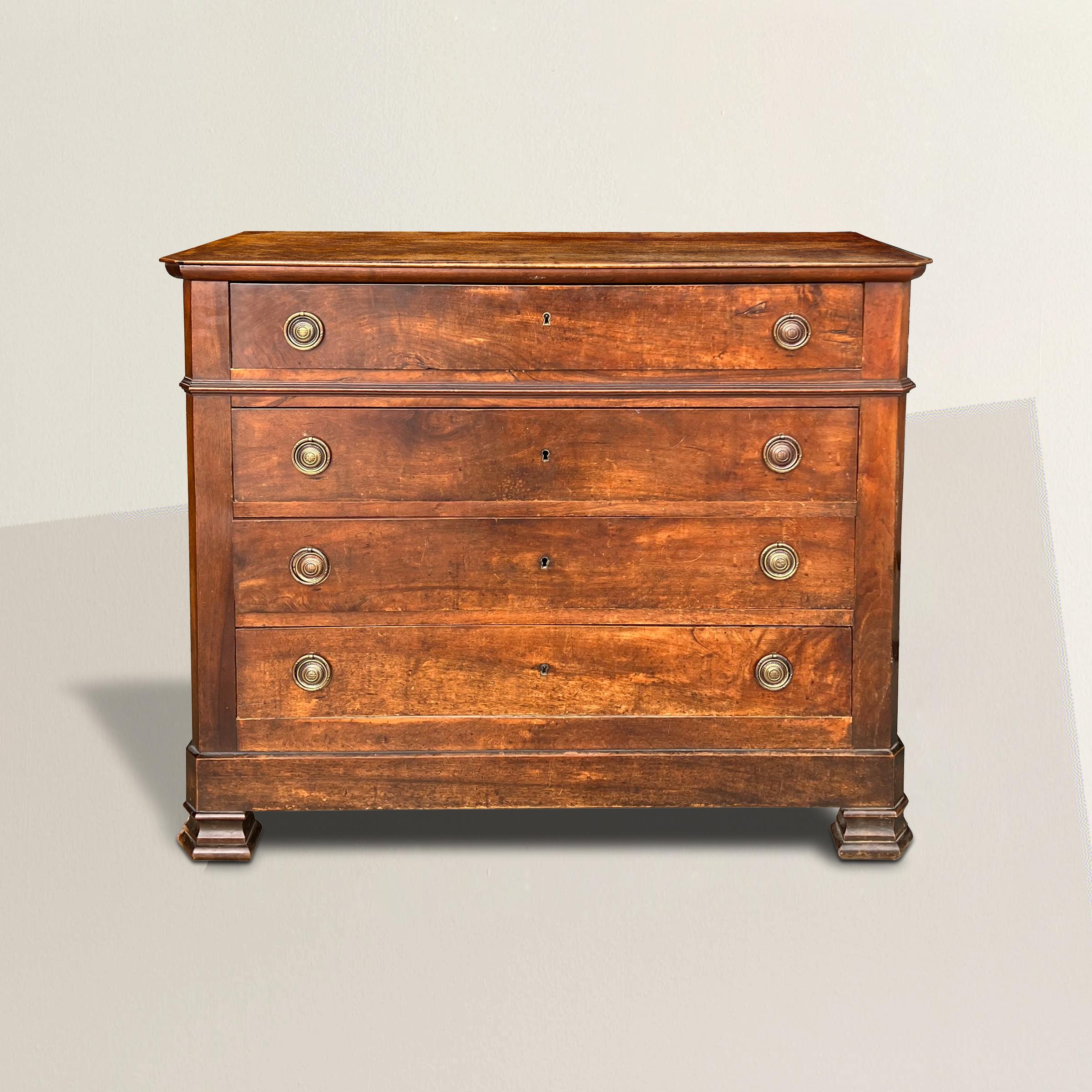 A simple but chic early 19th century French Louis Philippe period walnut chest with four drawers with newer brass ring pulls, and a wonderful, unusual, plaid patterned top. Perfect as a dresser in your bedroom or guest room, a console in you entry,