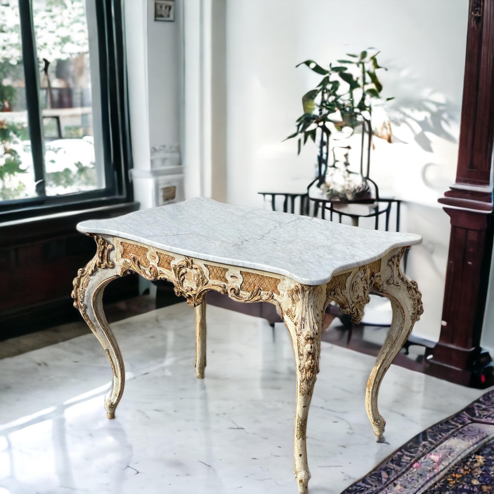 This is a beautiful early French Louis XIV style center table with serpentine marble top. The top is not attached. Note the beautiful patina with the significant wear to the gilt and paint. 

My shipping is for the Continental US only and can run