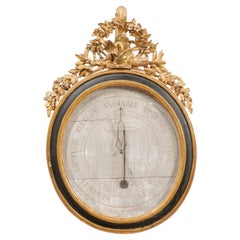 Barometro francese Luigi XVI del primo Ottocento, dorato ed ebanizzato, 1800 ca.