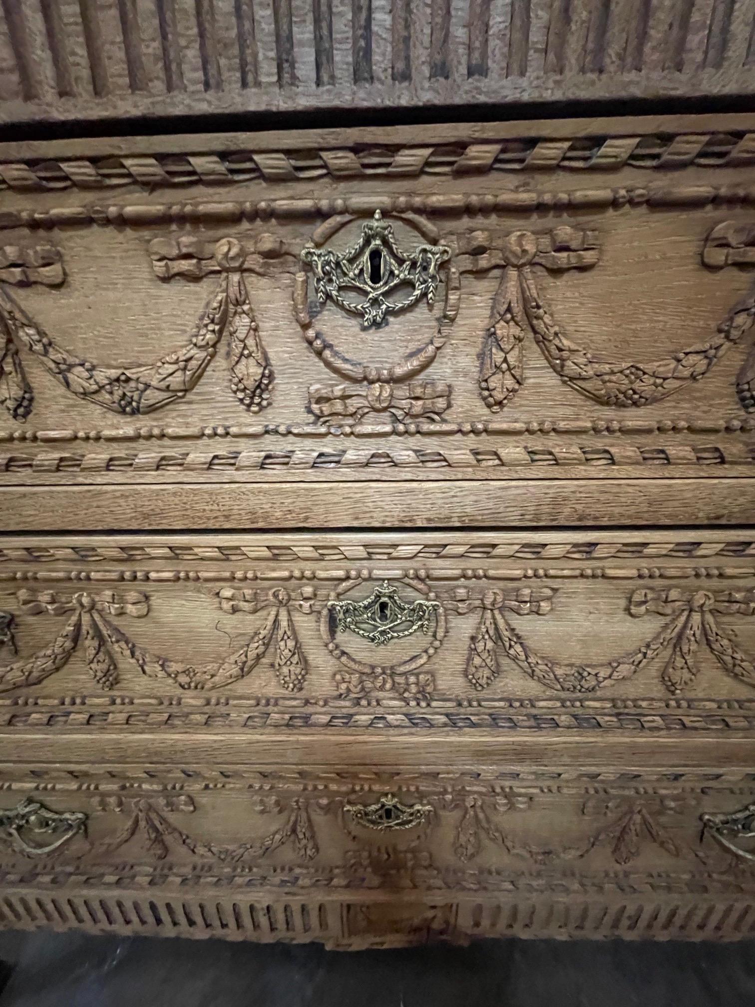 Beautifully carved early 19th century French Louis XVI style bleached commode. Very fine patina and ample storage as well. A gorgeous piece!!